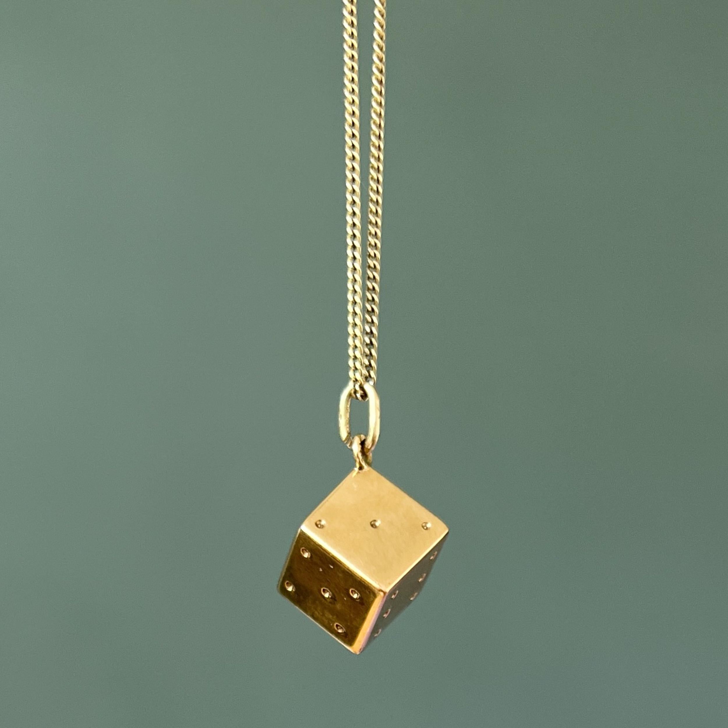 A three-dimensional vintage dice lucky charm pendant. The charm is beautifully stylized and crafted in 14 karat gold. Charms are great to collect as wearable memories, it has a symbolic and often a sentimental value. They can be added to your