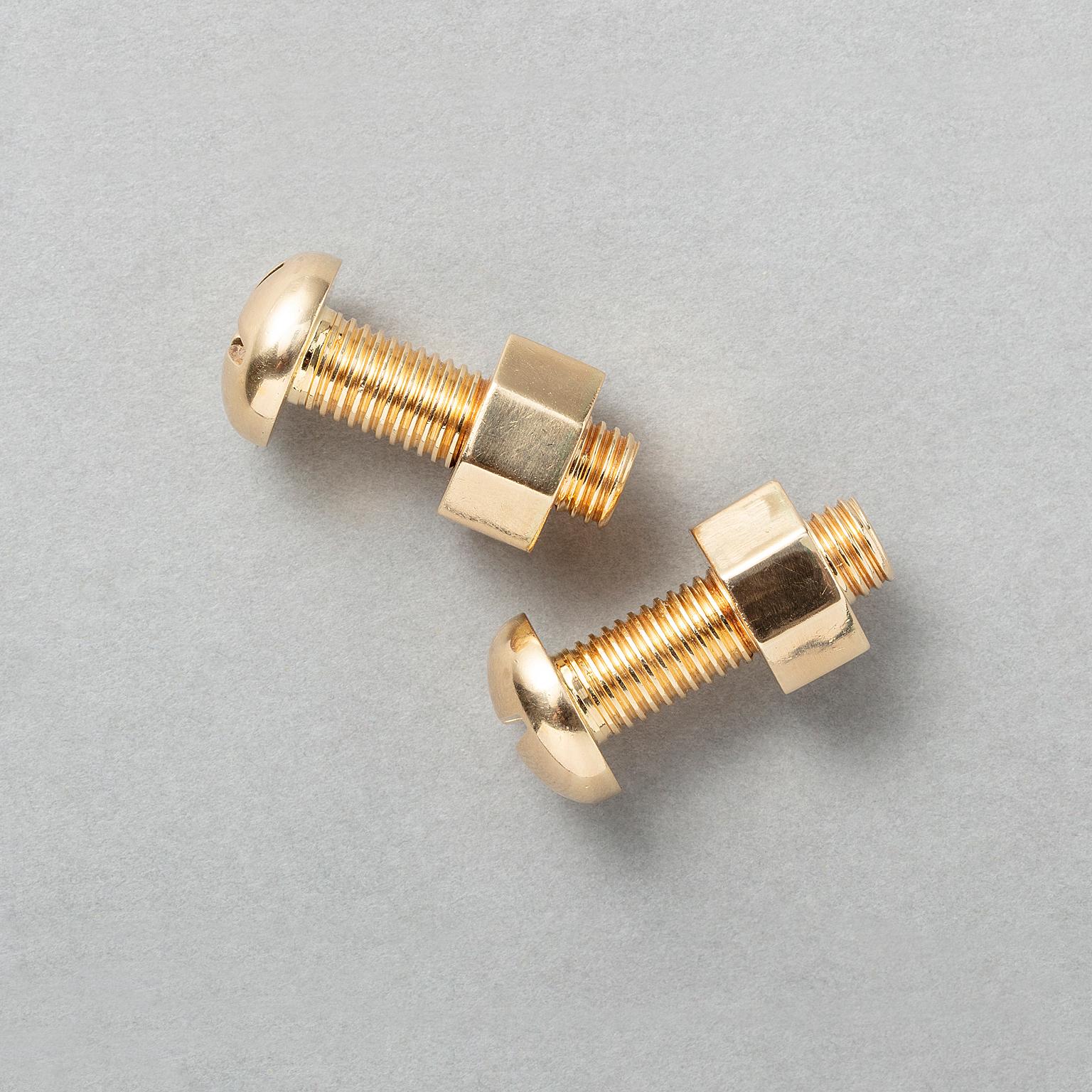 A pair of 14k gold figural nut and bolt cufflinks, signed: Tiffany & Co.

weight: 16.8 g
diameter: 1.2 cm