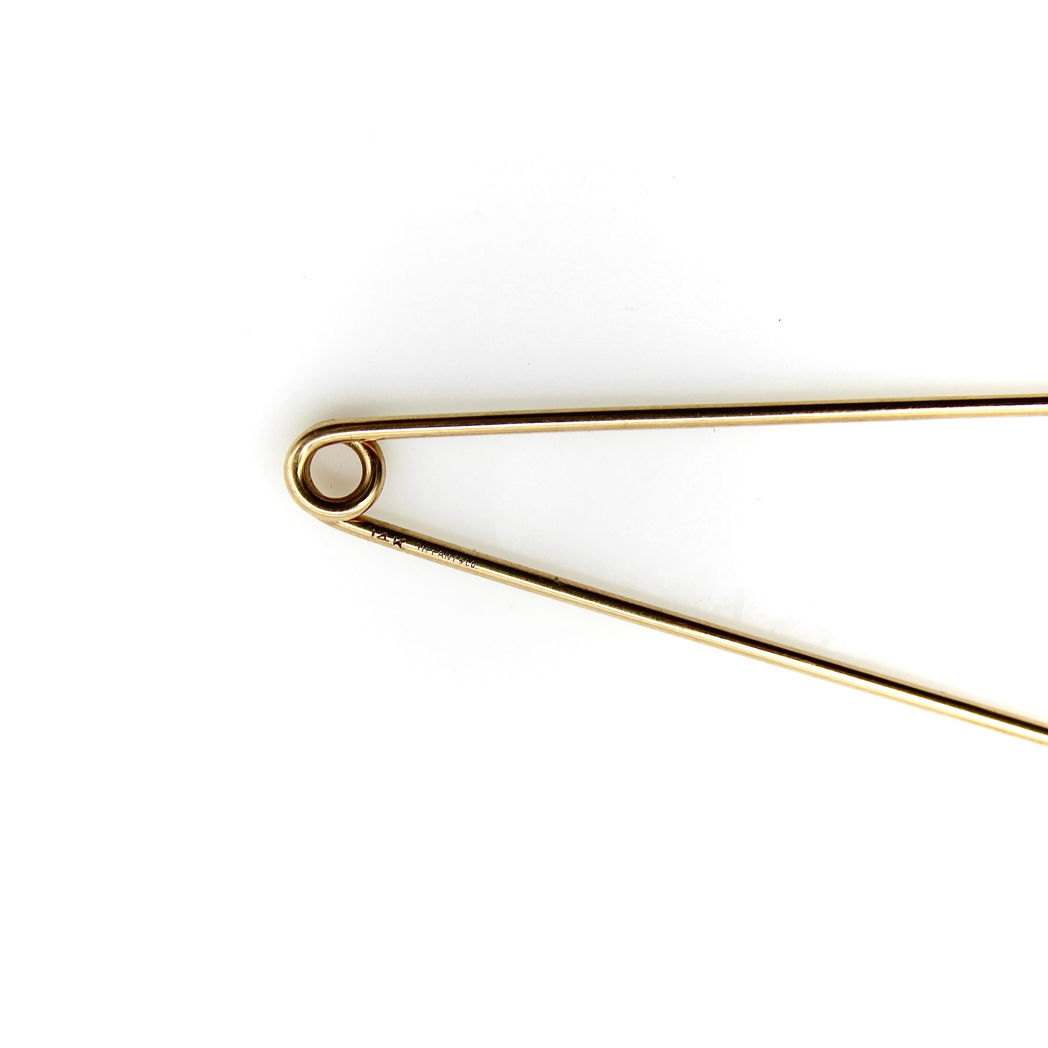 Tiffany & Co. has a history of safety pin jewelry that dates back to the 1940’s. Throughout the years, there have been many versions of the iconic safety pin, varying in shape, size, and decoration. This particular pin, circa the 1940’s, has the