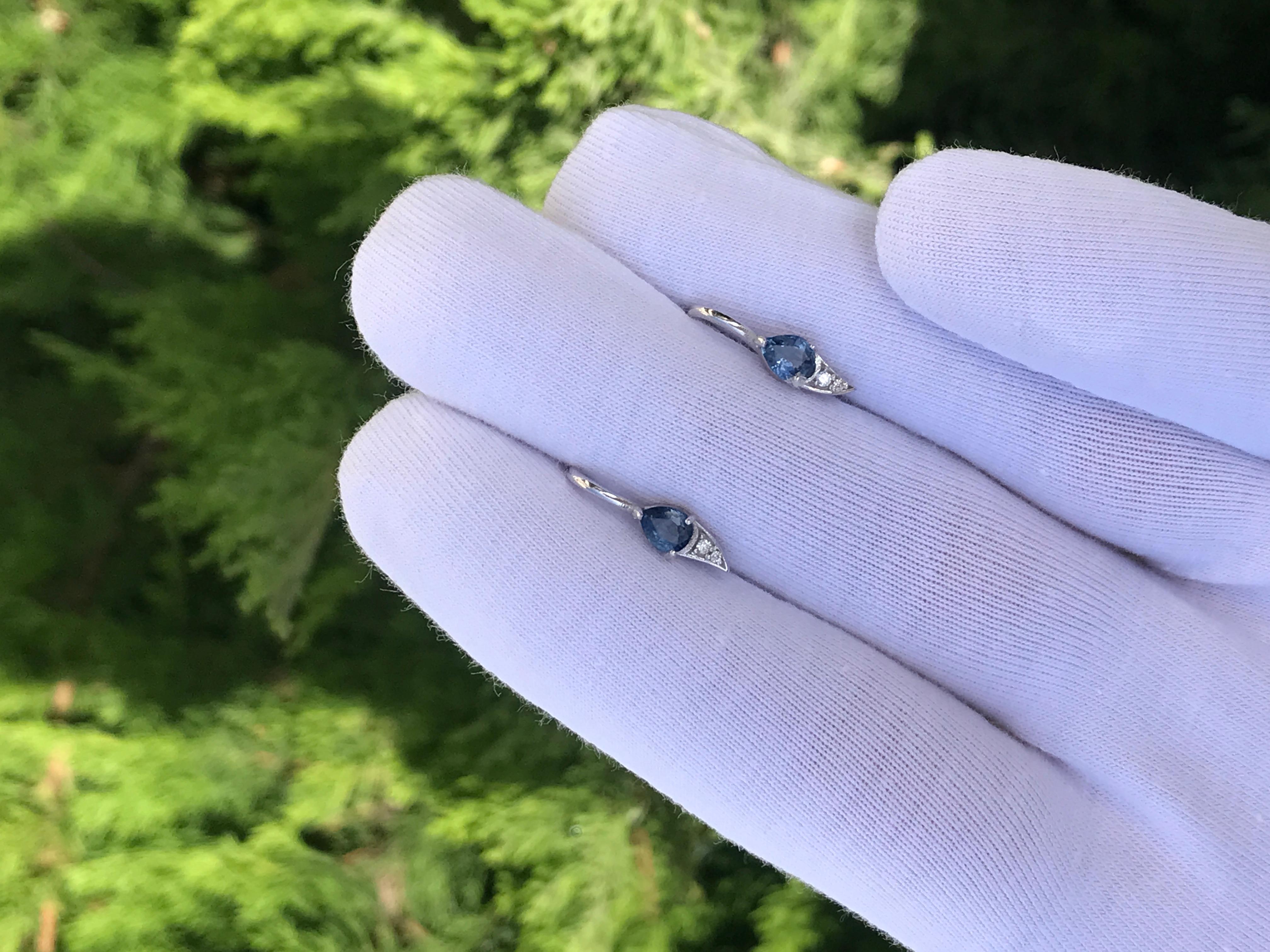 14k gold earrings with natural sapphires and diamonds. September birthstone earrings

14k solid gold
Weight: 1.5 g.
Size: 16.5 x 4.5 mm.

Central stones: 
Natural sapphires: weight - 0.9- 1.00 ct total (0.45-0.50 ct each), 2 pieces. 
Pear cut, blue