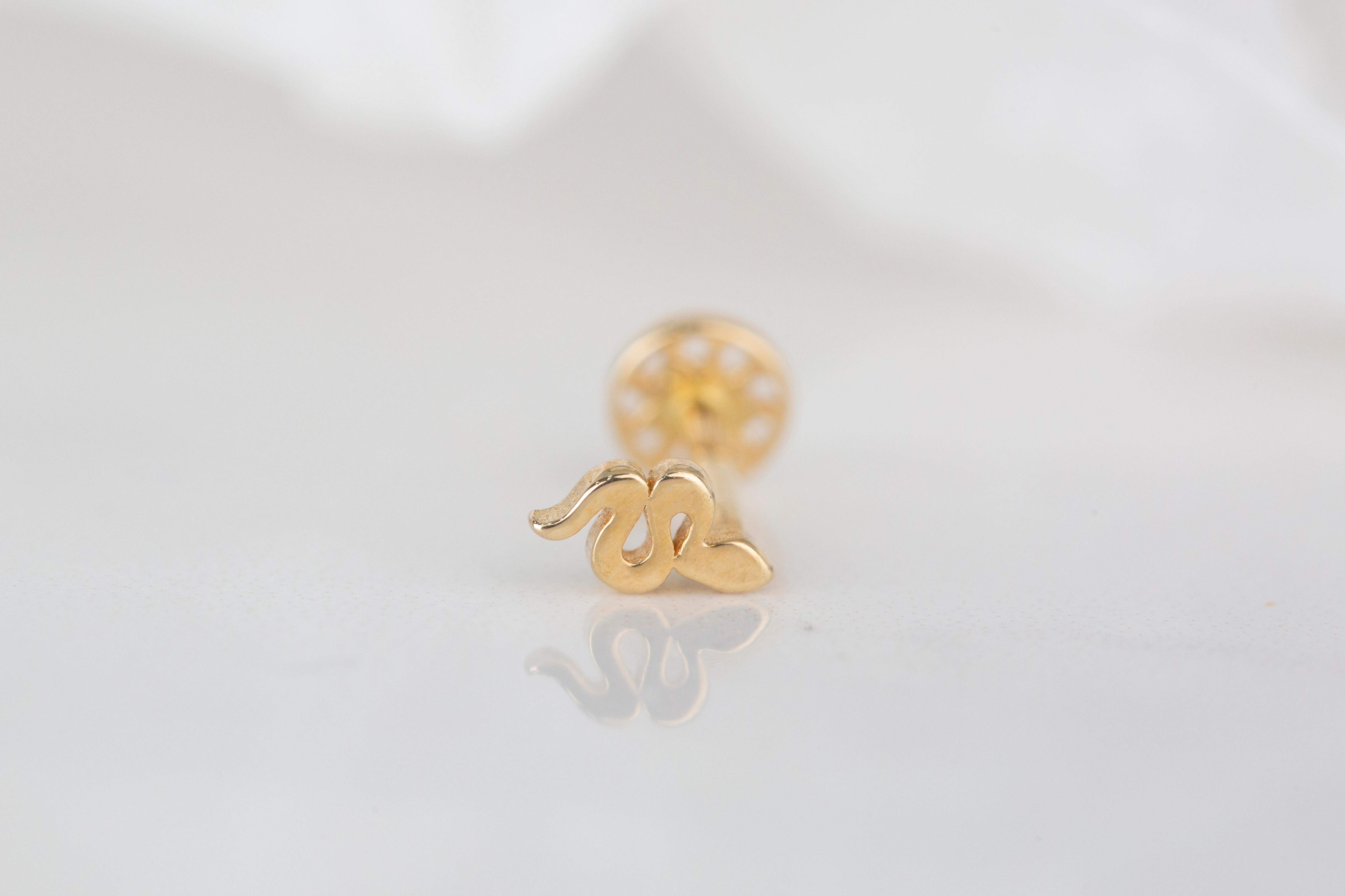 14K Gold Tiny Serpent Piercing, Small Snake Gold Stud Earring

You can use the piercing as an earring too! Also this piercing is suitable for tragus, nose, helix, lobe, flat, medusa, monreo, labret and stud.

This piercing was made with quality