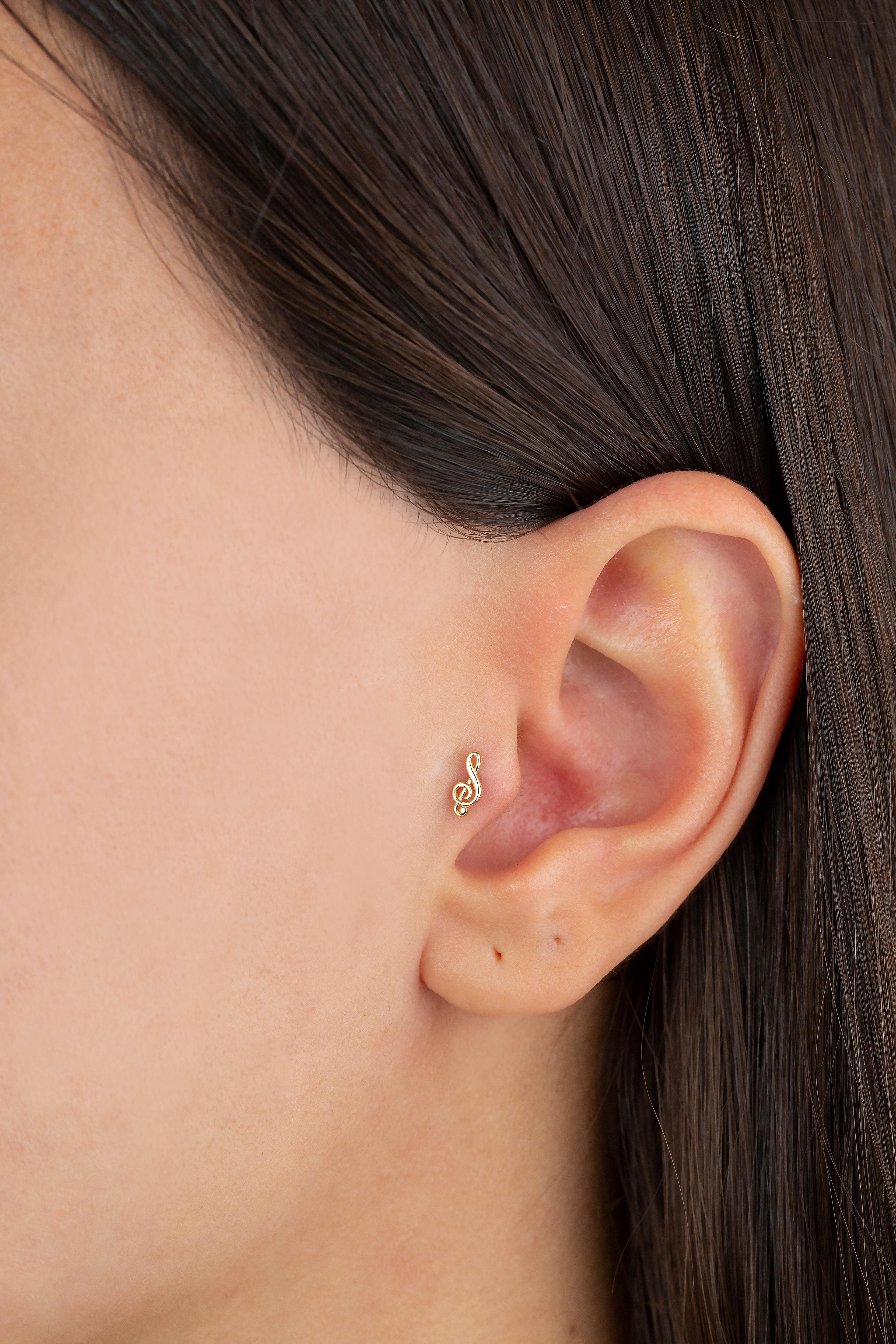 14K Gold Treble clef Piercing, Gold Stud Musical Note Earring

You can use the piercing as an earring too! Also this piercing is suitable for tragus, nose, helix, lobe, flat, medusa, monreo, labret and stud.

This piercing was made with quality