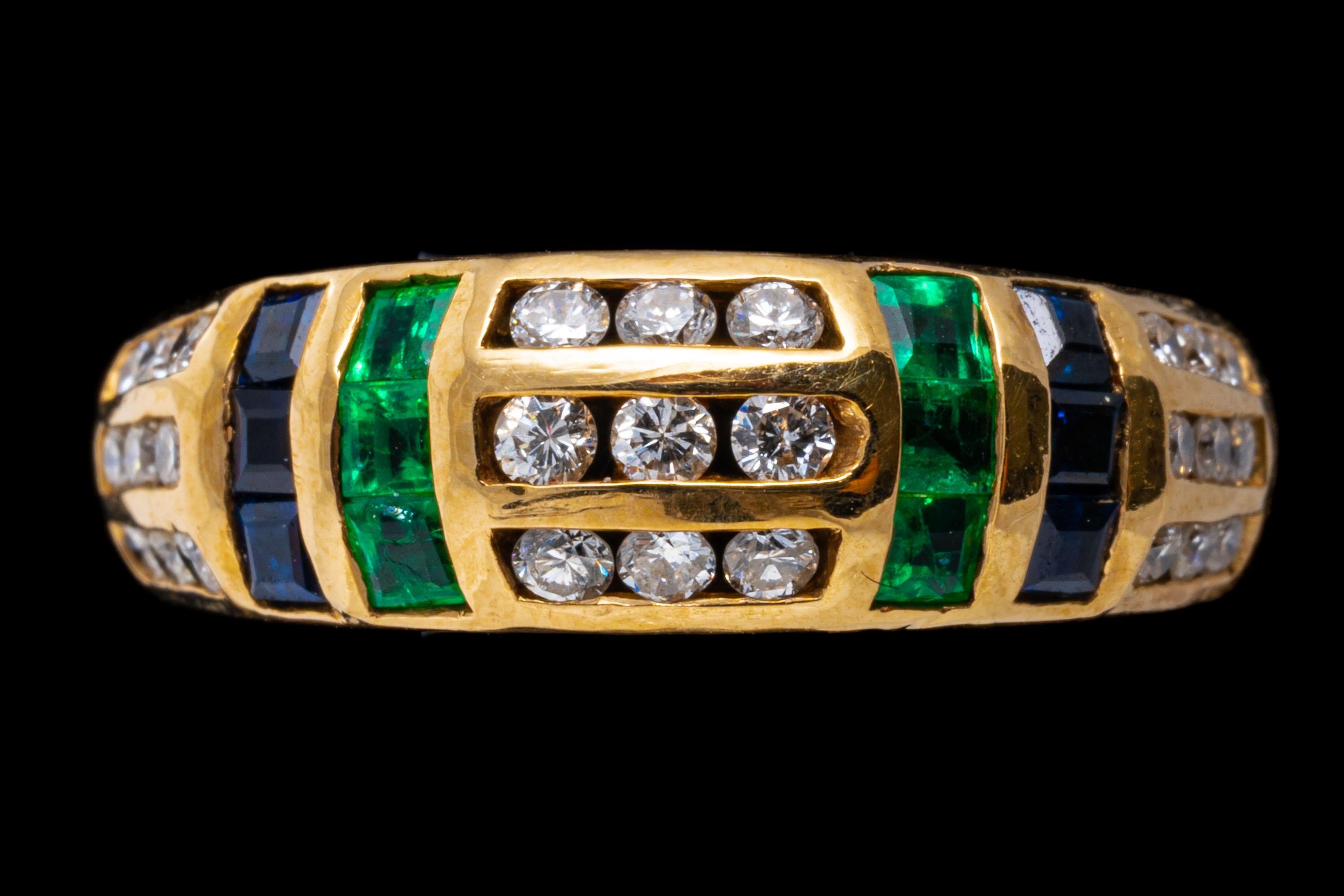 14k yellow gold ring. This gorgeous yellow ring is a triple row of round faceted, channel set diamonds, approximately 0.19 TCW, decorated with two vertical rows of square faceted sapphires, approximately 0.30 TCW, and square faceted, green emeralds,