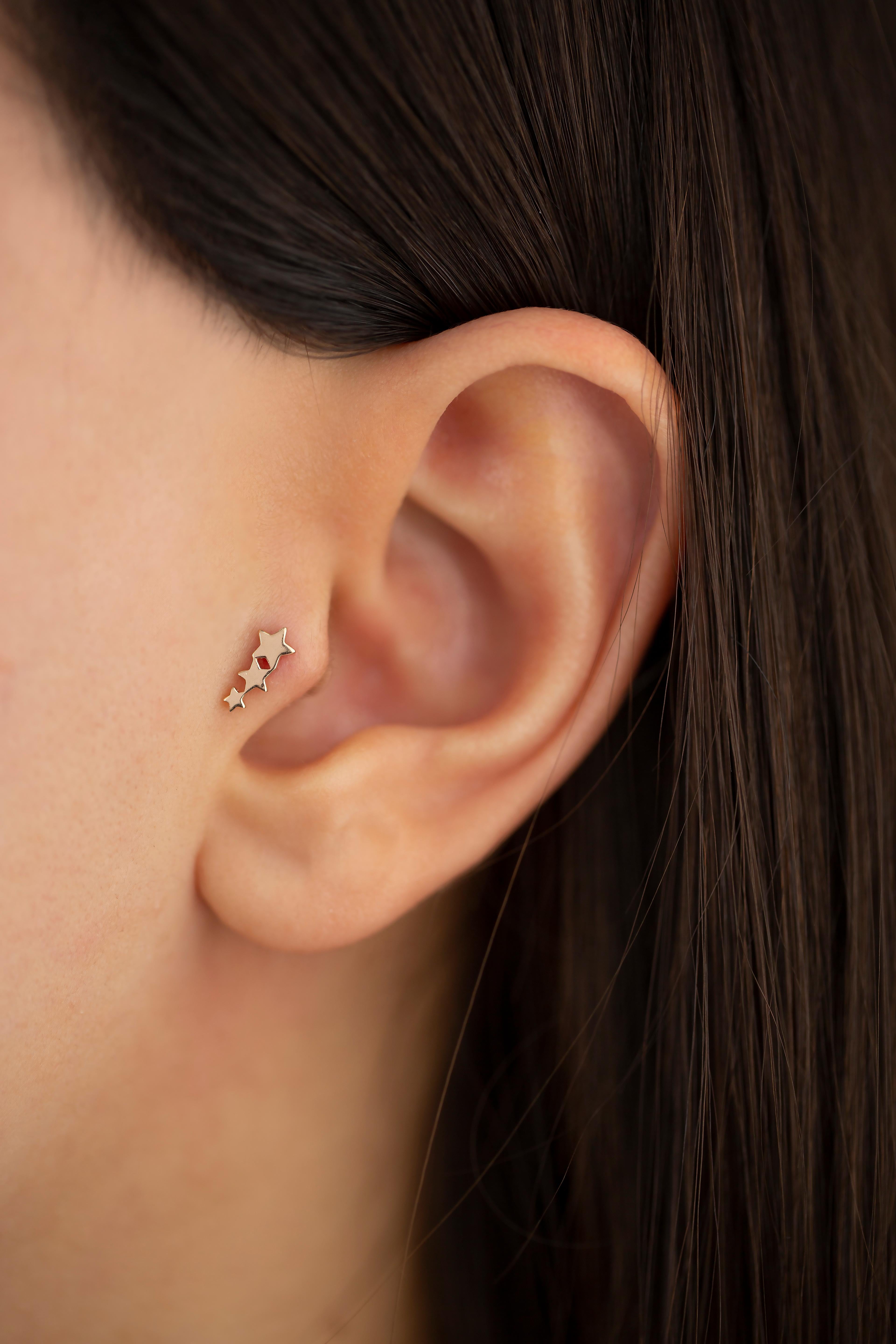 14K Gold Triple Stars Piercing, Gold Three Stars Earring

You can use the piercing as an earring too! Also this piercing is suitable for tragus, nose, helix, lobe, flat, medusa, monreo, labret and stud.

This piercing was made with quality materials