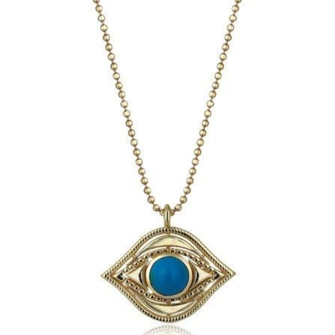Protect yourself from harm with this elegant Evil Eye charm pendant set with an turquoise.

Classic evil eye shape
Handcrafted from solid 14k gold
Opaque turquoise stone embedded in the center
Softly polished finish
This dainty charm holds the
