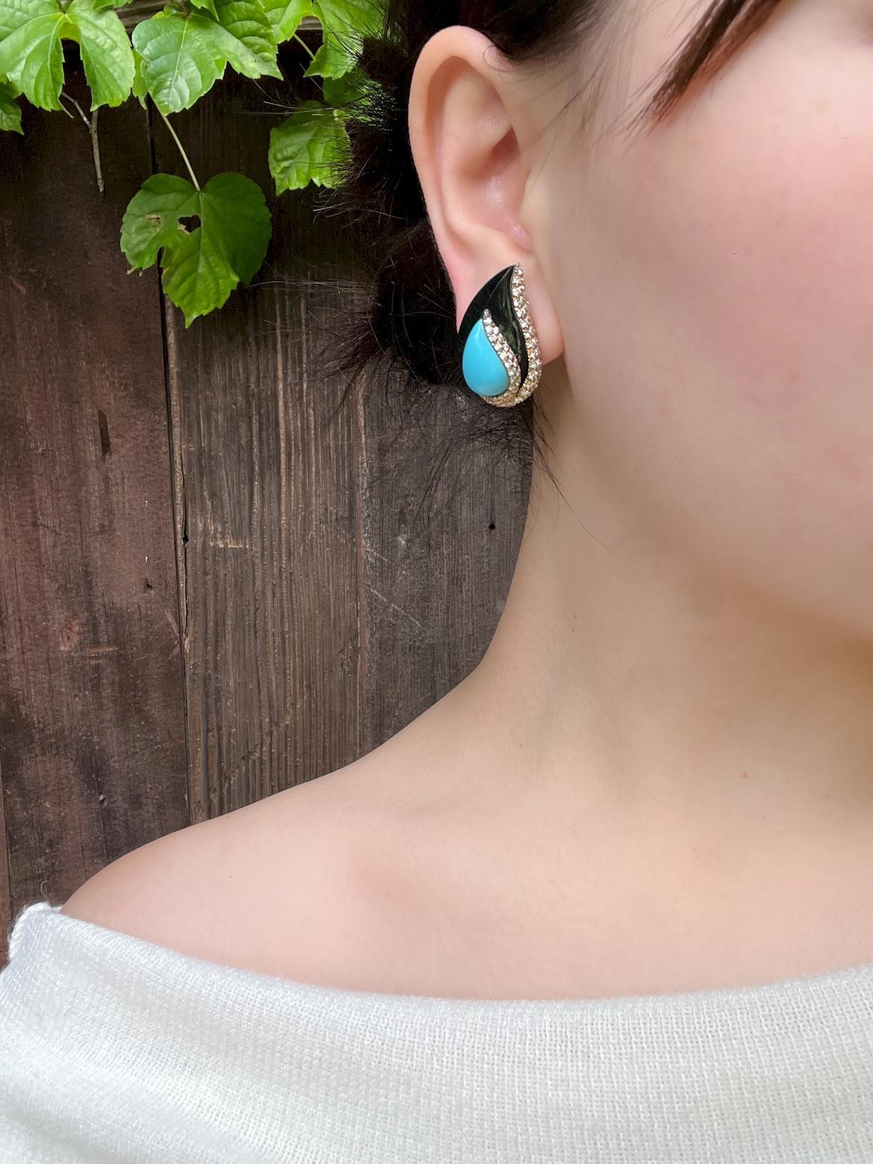 14K Gold Turquoise Onyx Diamond Earrings
Mounted with (2) Turquoise drop shape cabochons, several near-colorless Diamonds and Onyx.

Approximate Dimensions:
3cm (Length) 
2 cm (Width)
23 grams in weight.