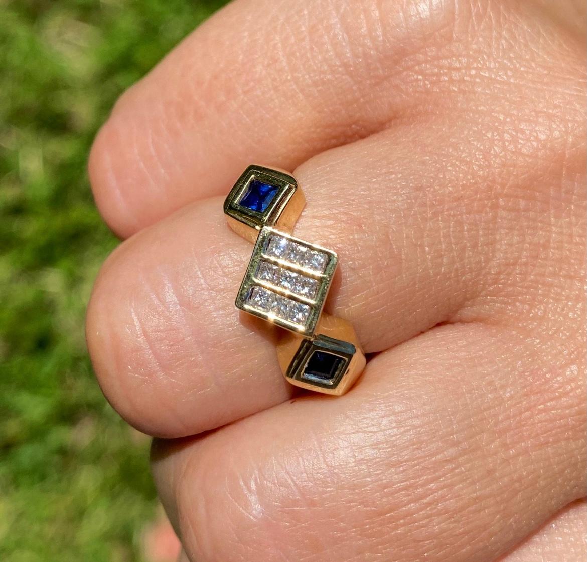 14k gold ring sets 0.40 carats in princess cut diamonds. This unique ring is handmade to suit both men and women, with a trendy geometric ring design and fine quality diamonds/sapphires.

✔ Gold Karat: 14K
✔ Diamond Weight: 9 Diamonds, 0.40 carats