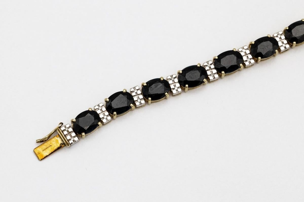 Oval Cut 14K gold vintage tennis bracelet with sapphires and diamonds
