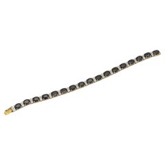 14K gold vintage tennis bracelet with sapphires and diamonds