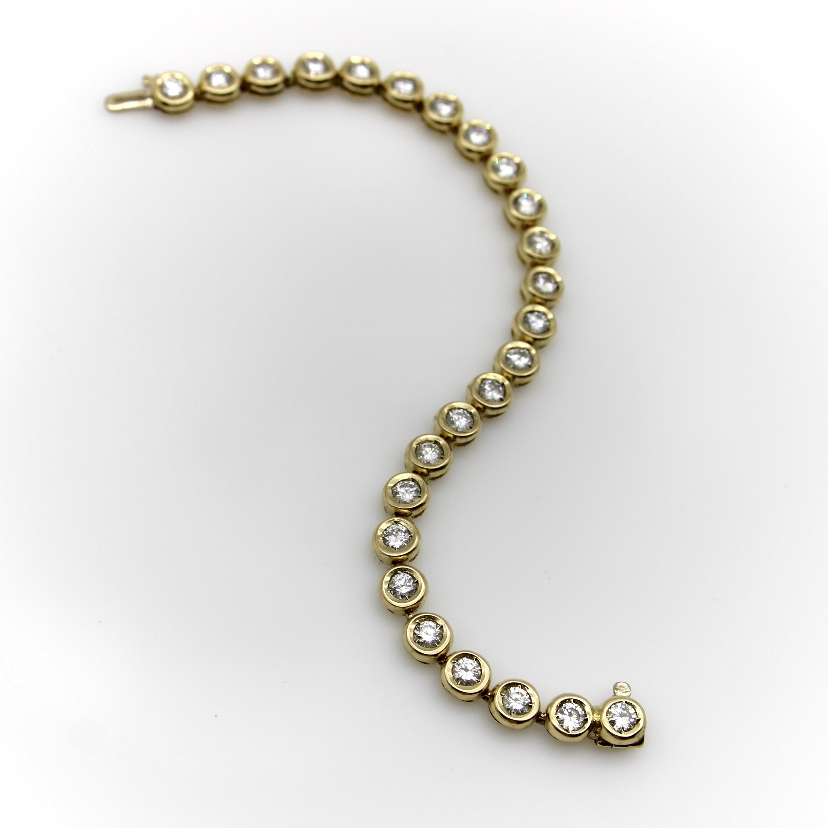 This 14k gold vintage bracelet consists of circular links, each with a natural diamond in its center. The bracelet sparkles with 25 diamonds for an impressive carat weight of 3.5. The circular links are inset to create a mount, and the gold is