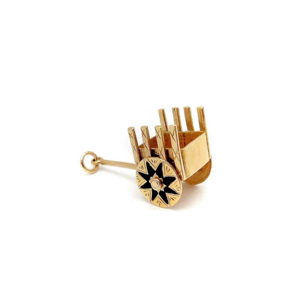 14k Gold Vintage European Cart Charm With Black Enamel

This is a vintage 14k Euro cart charm-pendant with so many thoughtful details. The wheels are mechanical and have beautiful black enamel in the shape of spokes. There is intricate bright cut