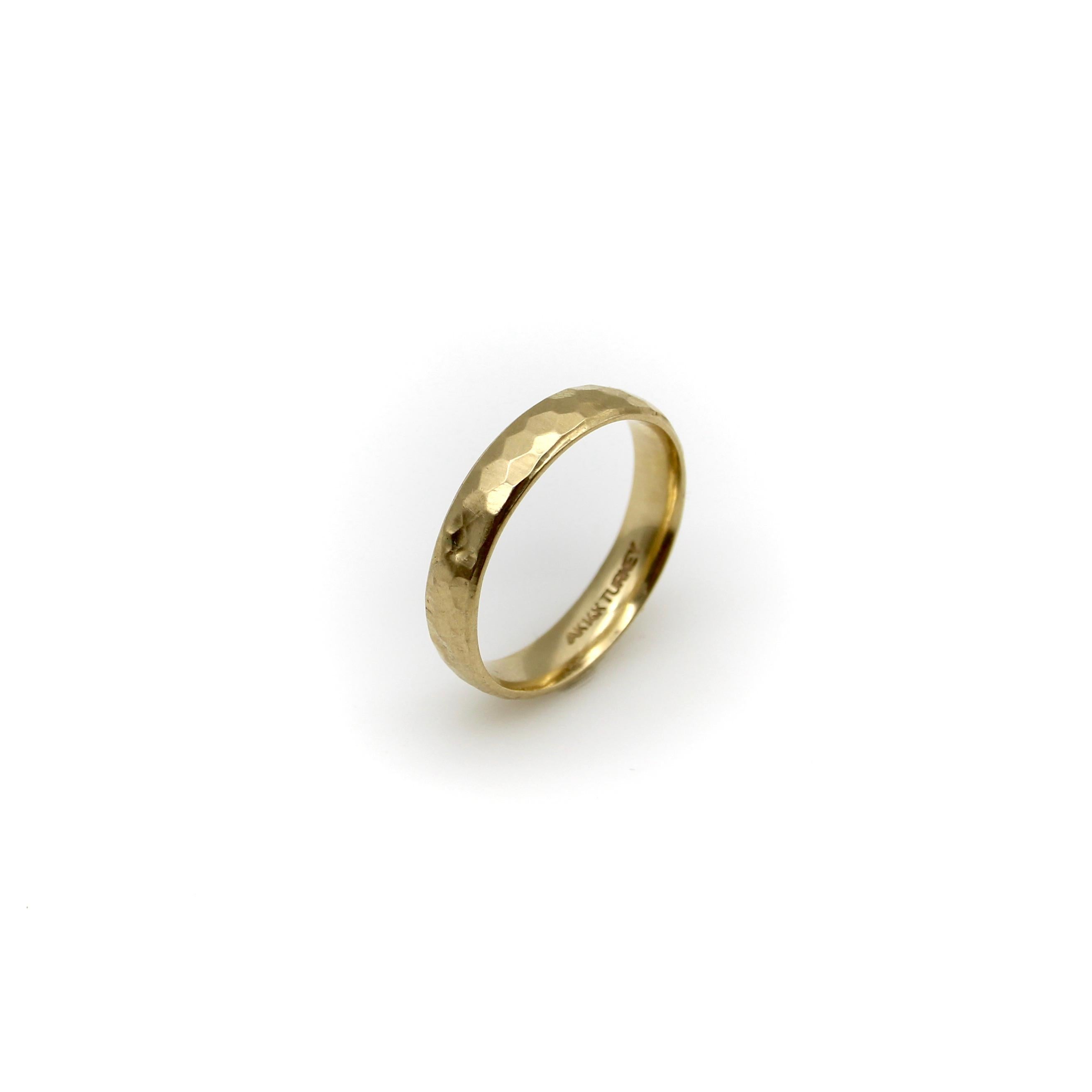 This hammered 14k gold band is a perfect staple in any jewelry collection. Its hollow construction keeps the ring’s gold weight down and allows for the maximum bang for your buck! A hammered surface textures the ring for a faceted look with