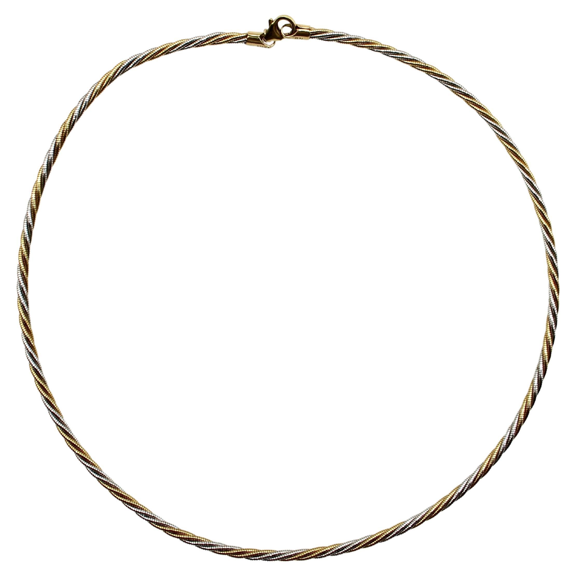 This elegant, Italian double twisted rope necklace is made of 14k yellow and white gold. The bi-color design on this necklace makes it versatile and gives this vintage piece a classic look. The necklace is nice and thick, with good presence,