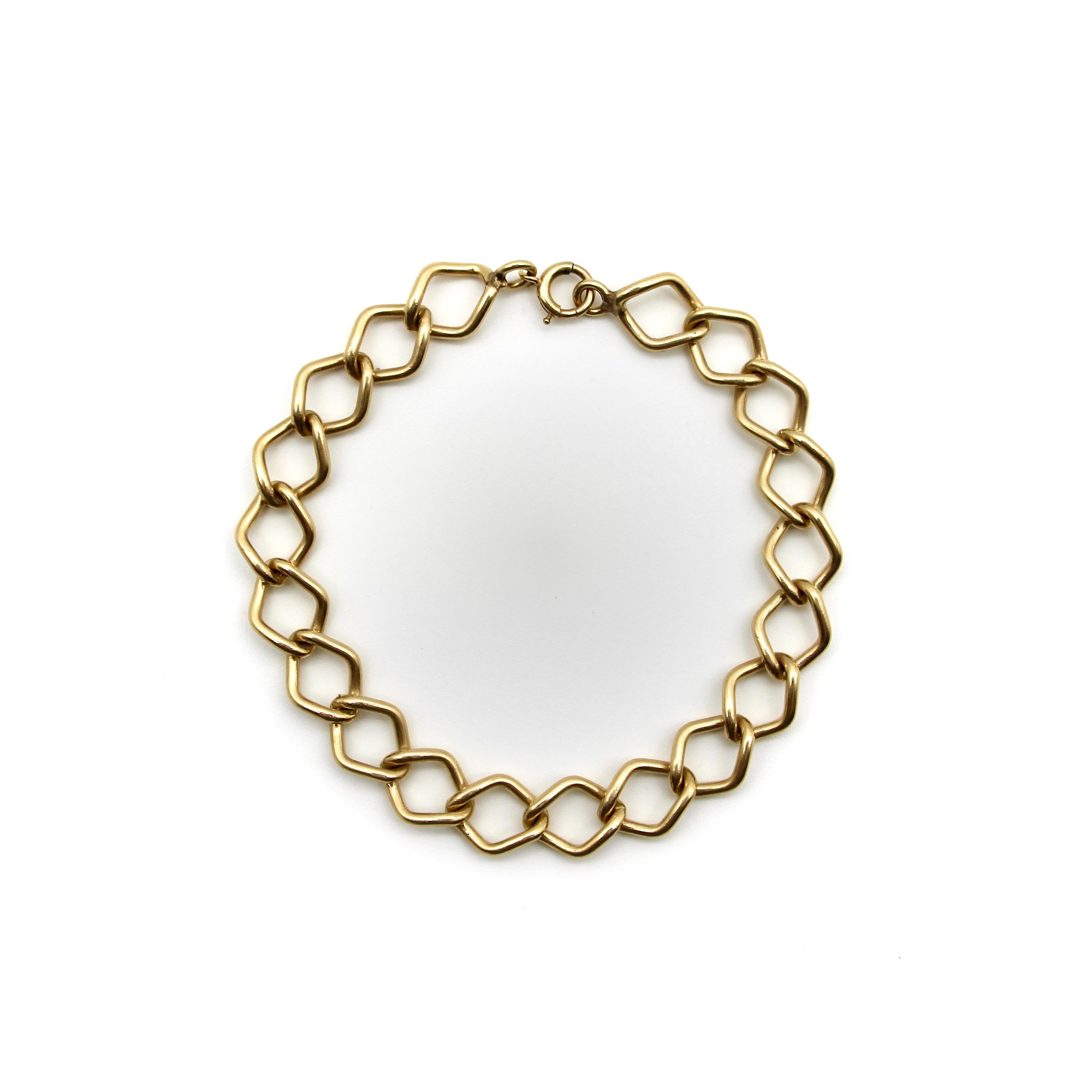 It’s amazing how many different types of links chains can be made up of. This 14k gold bracelet has a variation you don’t see often. Elongated diamond links intertwine at the point of juncture, reminiscent of a chain link fence, and making for a