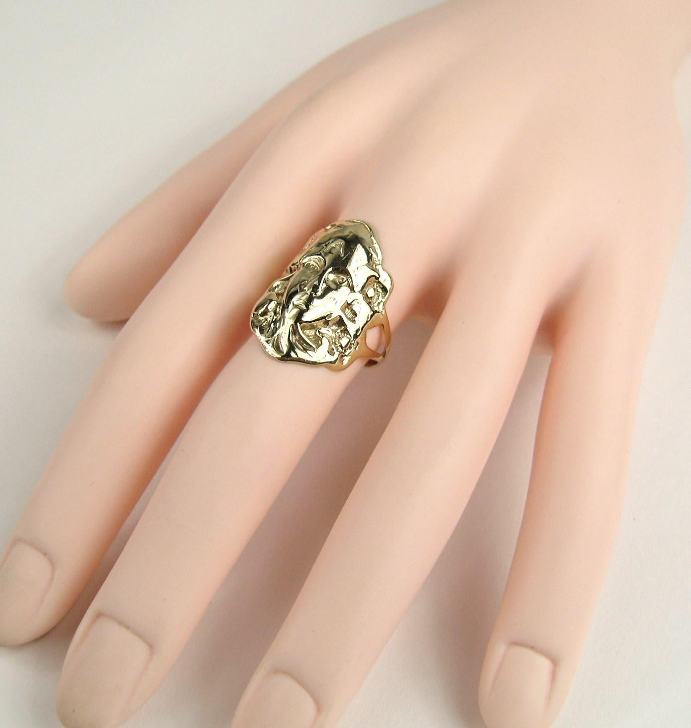 ring with woman's face