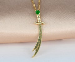 14K Gold Zulfikar sword pendant with emerald, diamonds.