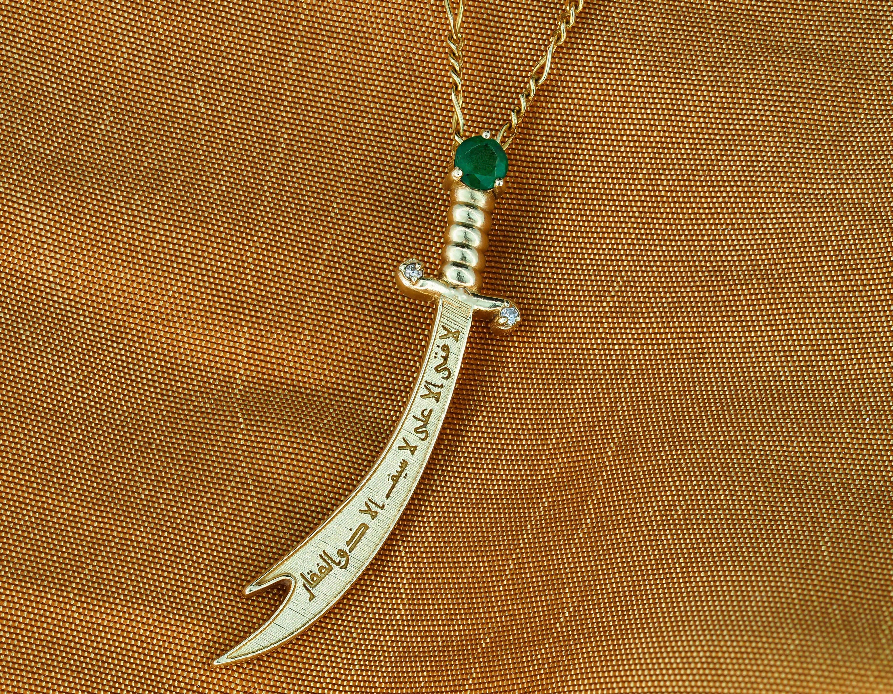 Modern 14K Gold Zulfikar sword pendant with emerald, diamonds.  For Sale