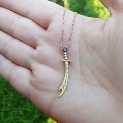 14K Gold Zulfikar sword pendant with sapphire