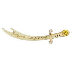 14K Gold Zulfikar sword pendant with yellow sapphire