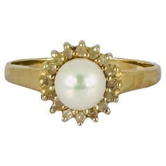 Anello d'oro 14k con perla rotonda e 18 diamanti da 0,18 carati
