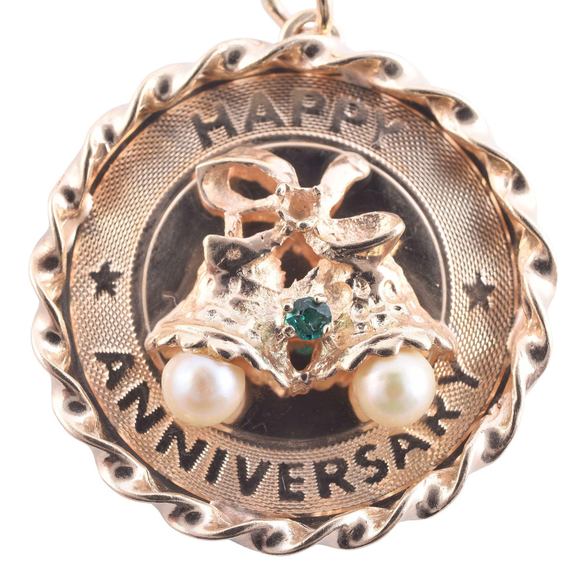Vintage 14K Happy Anniversary Pendant or Charm, circa 1950. This round vintage charm is crafted in 14 karat yellow gold and features pearls. [KIMH 544]
Dimensions
26mm diameter x 5mm D