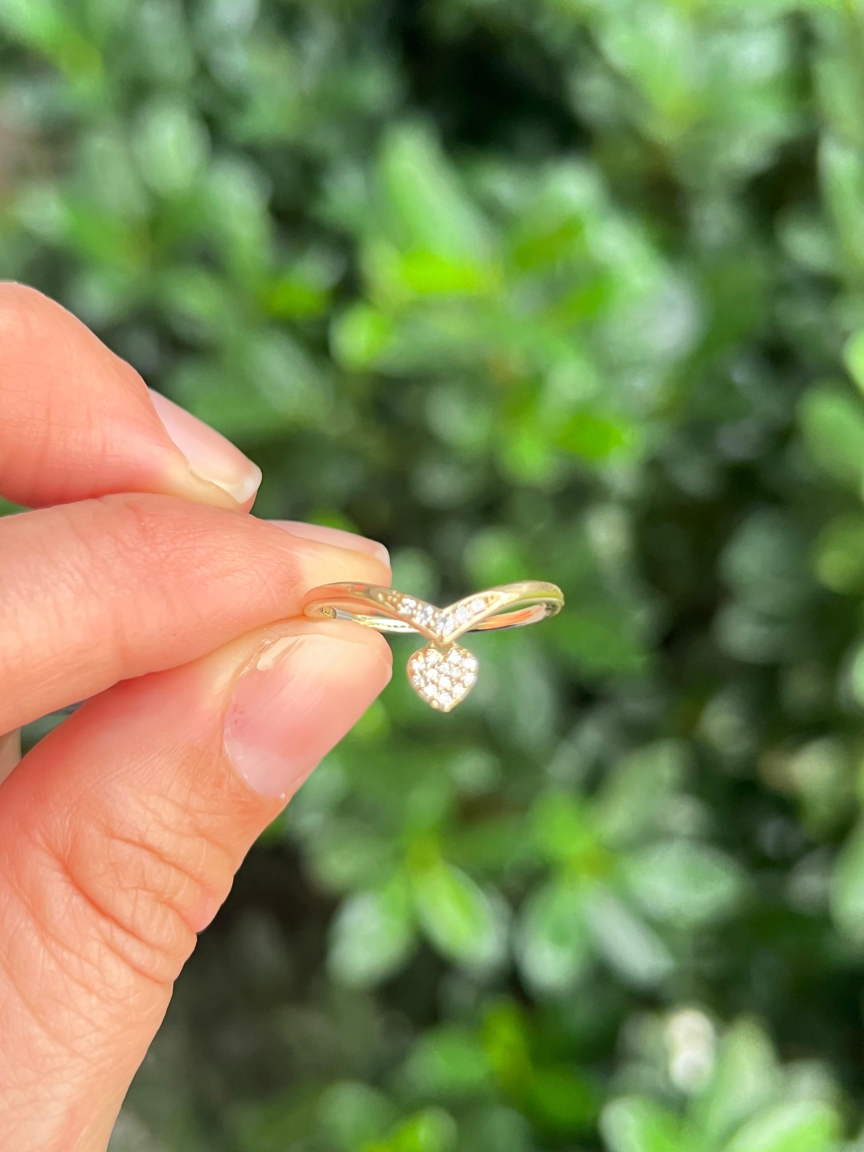 gold ring with dangling charm