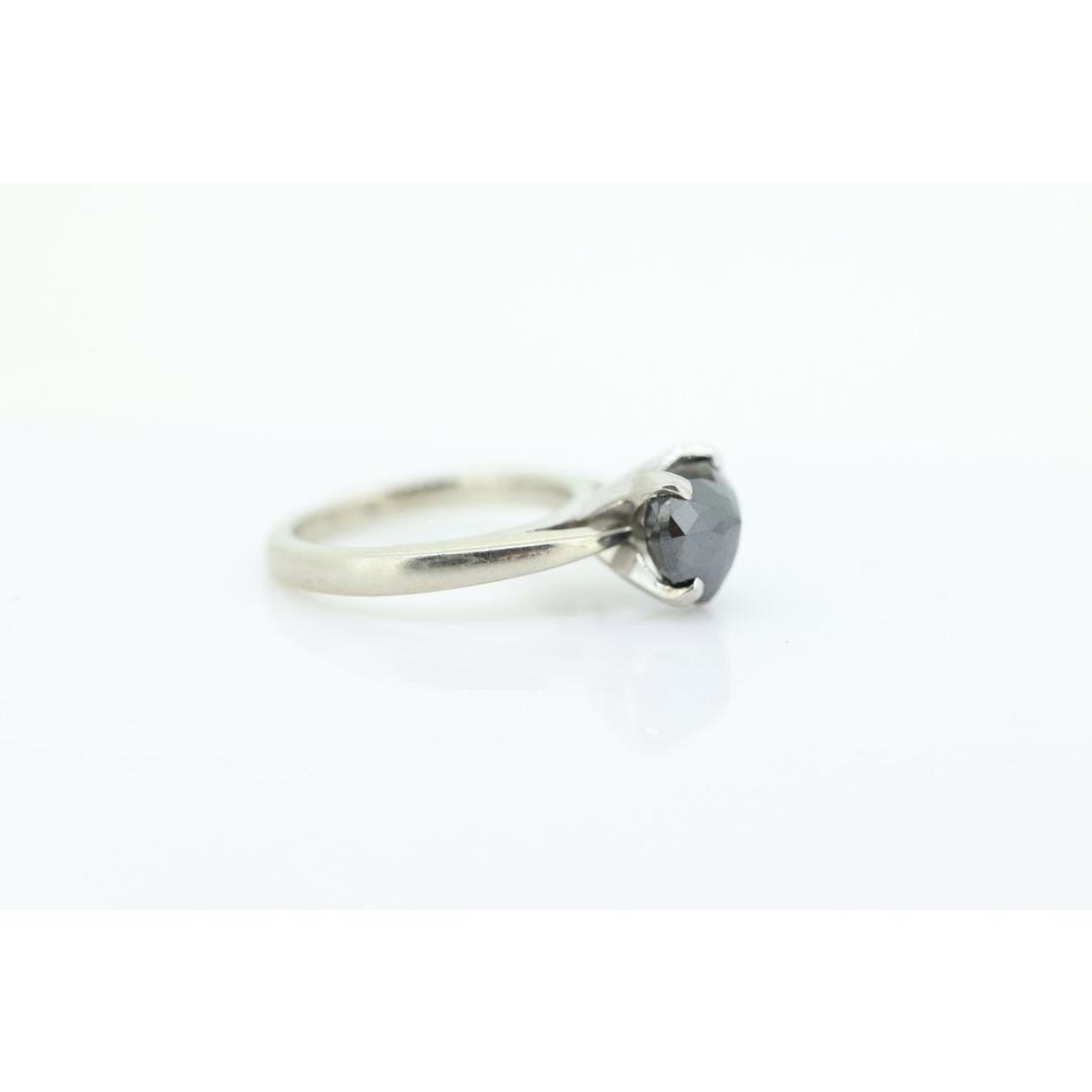 Vintage
Size: 4 US
Materials: Stone
Gemstone: Diamond
Gem color: Black

Style: Mid-century

Very unique ring. Diamond cut heart solitaire Black diamond.

7mm by 8.5mm heart diamond
Jet Black Diamond multi faceted
EST weight at 2ct.
3.2grams total