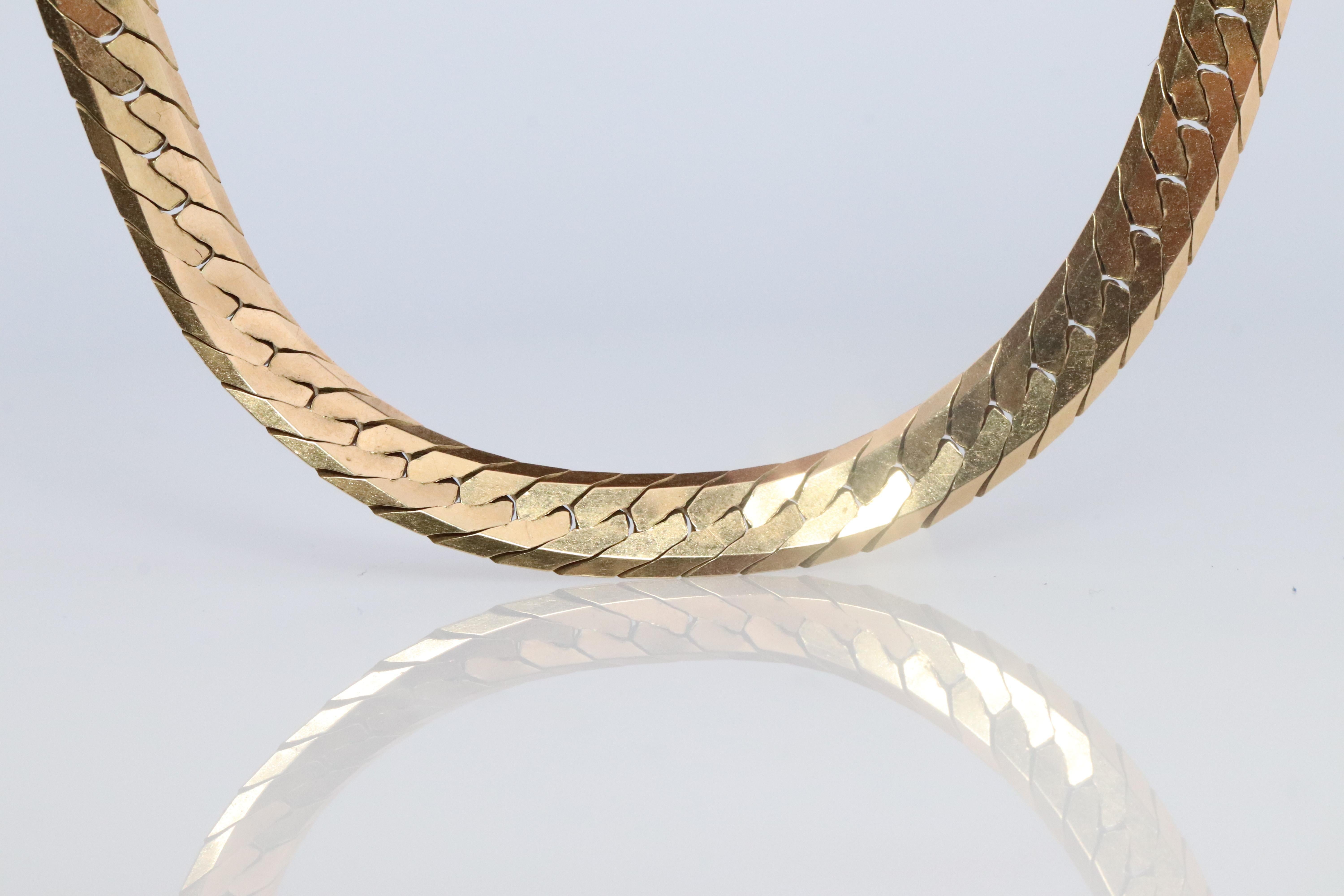 14k Yellow Gold Herringbone Chain Necklace.

High polish and High Shine Herringbone Italian necklace. 

Very heavy. Made in Italy by ACA

Details:
5mm wide
19.5inch length.
14k yellow gold at 19.2 grams total.