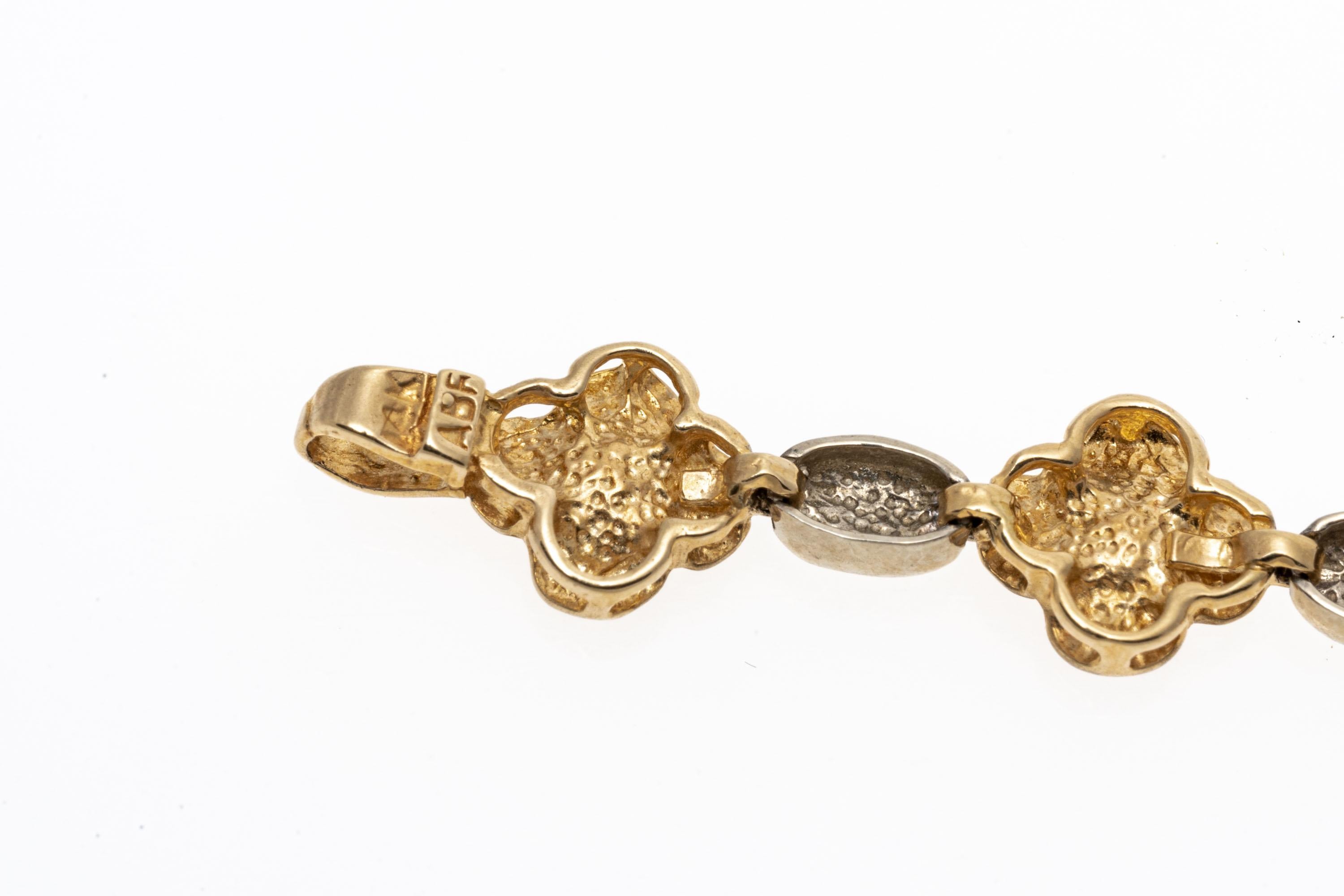 An Italian line bracelet crafted from 14K gold. This charming line bracelet has an alternating design of yellow gold flowers with a matte finish and polished white gold connecting links. Lobster claw style clasp.
Marks: 14K Italy ABF
Dimensions: 7