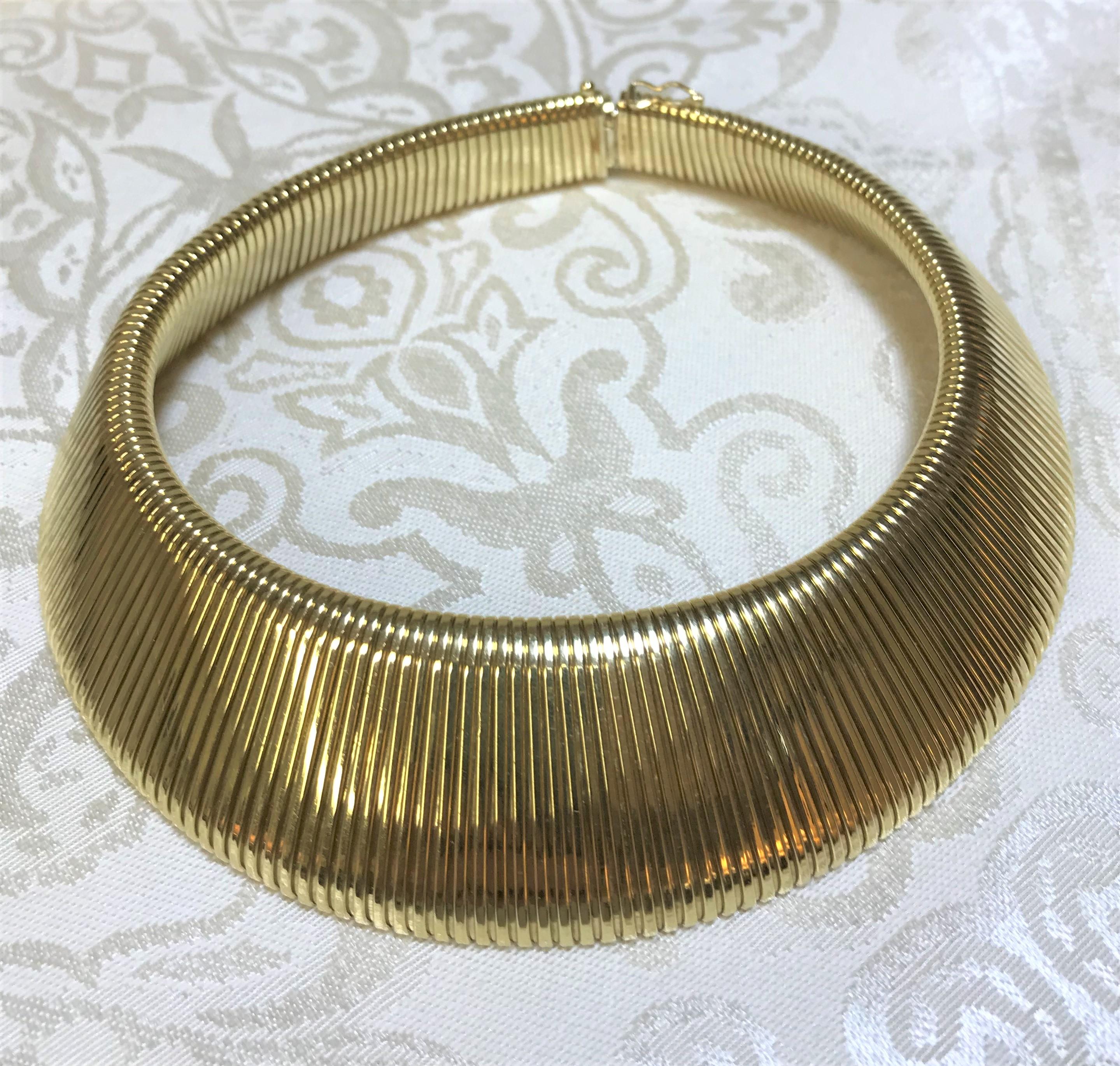 This beautiful omega choker will complete any outfit!  Light weight, flexible and very easy to wear; this piece rests nicely on the neck - very flattering!
14 karat yellow gold
Graduates from approximately .75 inches to 1.75 inches