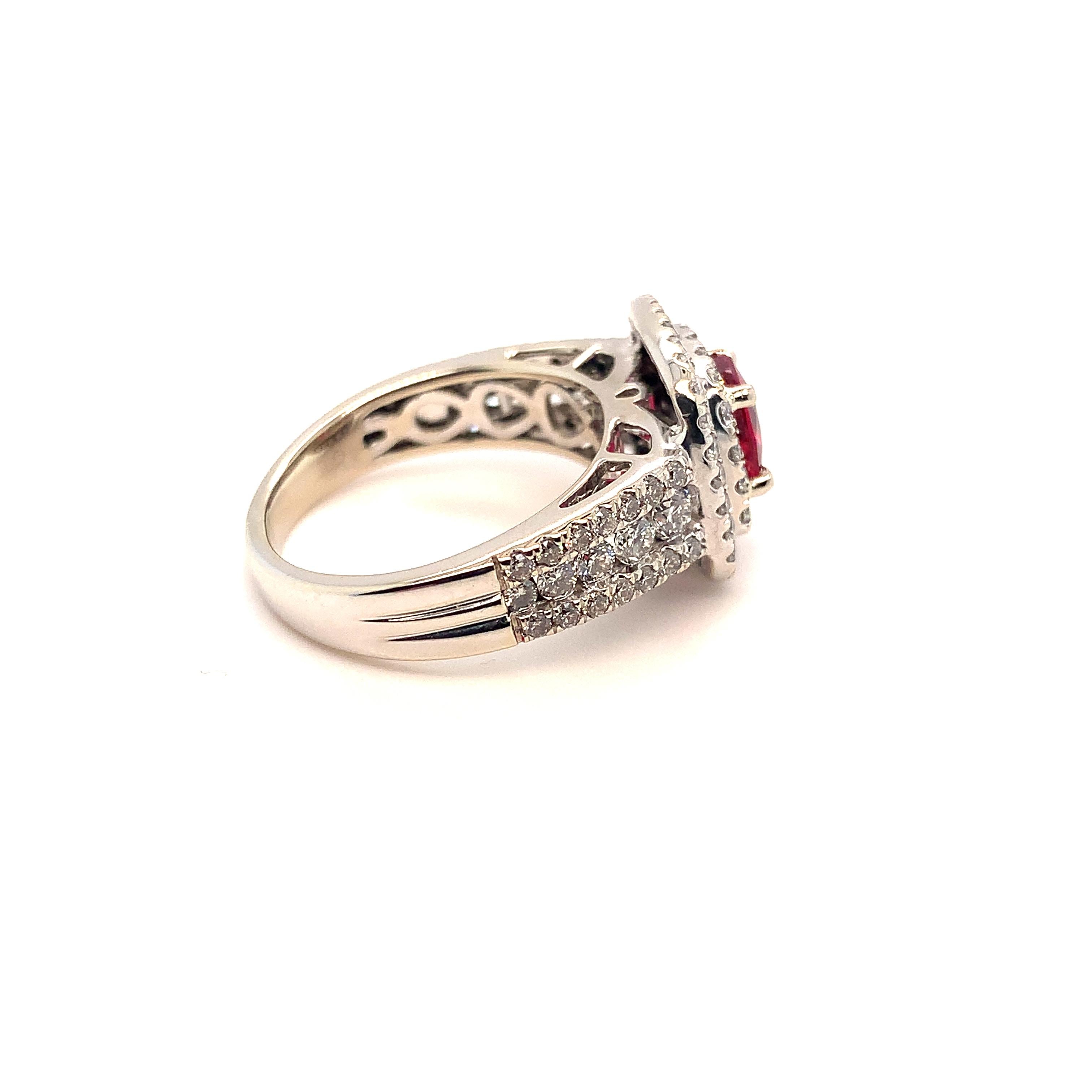 14K white gold diamond ring featuring a jedi red spinel. The red spinel weighs .91 carats and comes with a GFCO report stating Burmese and no heat. The spinel is cushion cut and measures 6.6mm x 5.8mm x 2.7mm. There is a double halo of small white