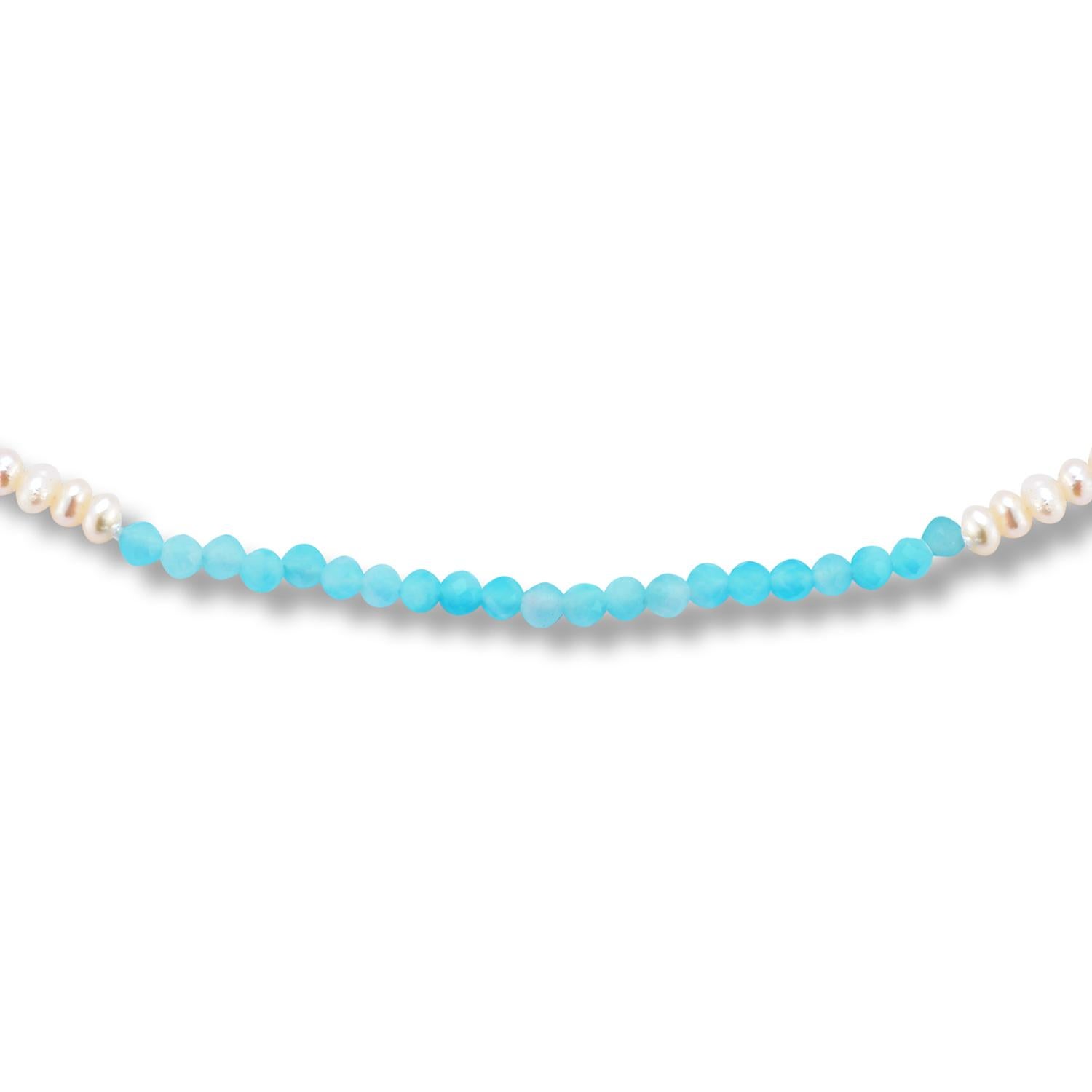 This is no ordinary pearl choker with a pop of color in the form of color block with faceted semi-precious Amazonite stones. A fun layering piece for all seasons if you like to layer your necklaces with beaded pieces and chains.

Inspired by the