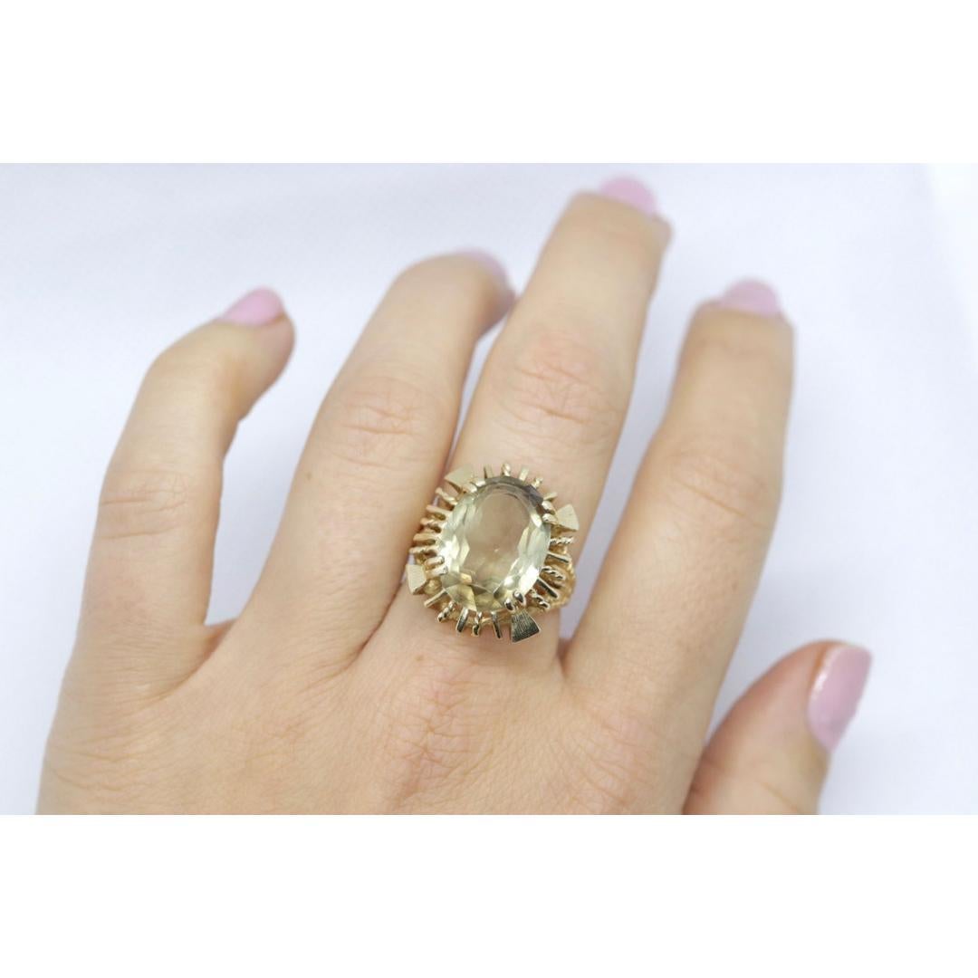 Vintage from the 1980s
Size: 7
Materials: Gold
Gemstone: Amethyst
Gem color: Green

Band color: Gold

This one is a stunner. Large Green Amethyst set into 14k Yellow Gold filigree cathedral shank. Large and heavy ring. Will make you stand