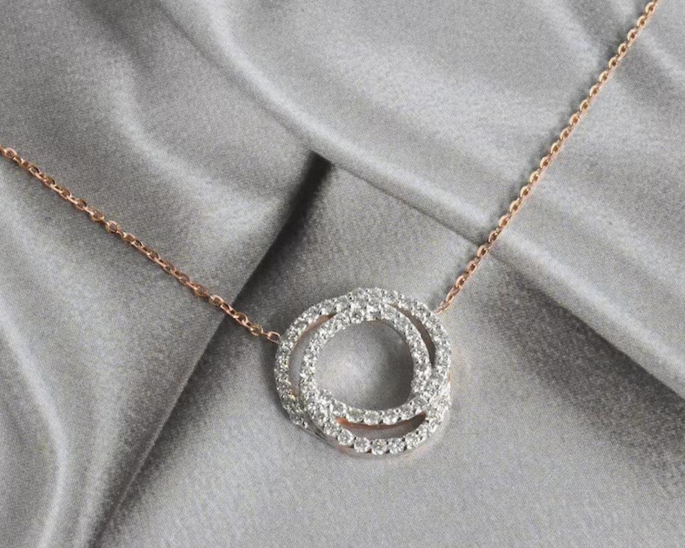 Round Cut 14k Gold Love Knot Diamond Pendant Necklace Diamond Love Necklace For Sale