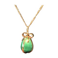 14 Karat Malachite Egg Pendent Featuring Bow Motif