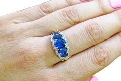 14k Man Made Saphire & Diamond Ladies Ring.