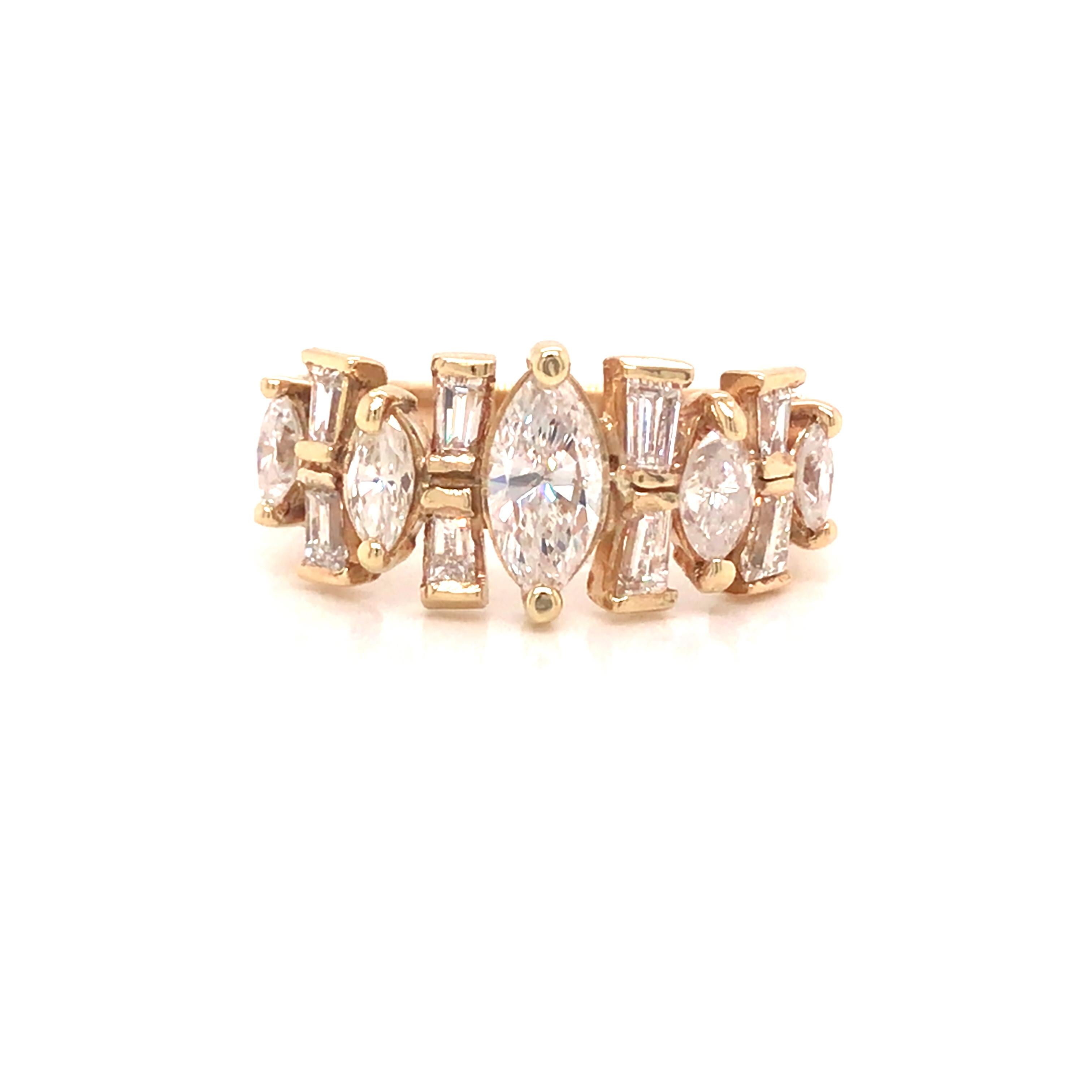 Marquise and Baguette Diamond Band in 14K Yellow Gold.  (5) Marquise and (8) Baguette Diamonds weighing 1.28 carat total weight, F-G in color and VS-SI in clarity are expertly set.  The Band measures 3/8 inch in width.  Ring size 6.  4.97 grams.
