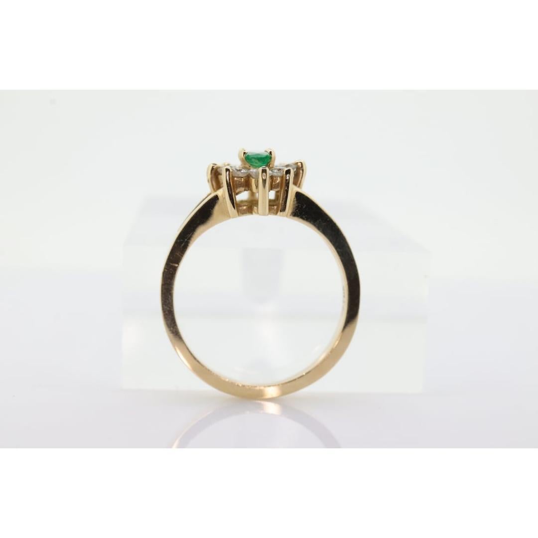 Women's 14k Marquise Emerald and Diamond Halo yellow gold ring. 0.36ctw in diamonds