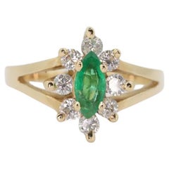 Anello in oro giallo 14k con smeraldo marquise e diamanti a raggiera. 0,36ctw di diamanti