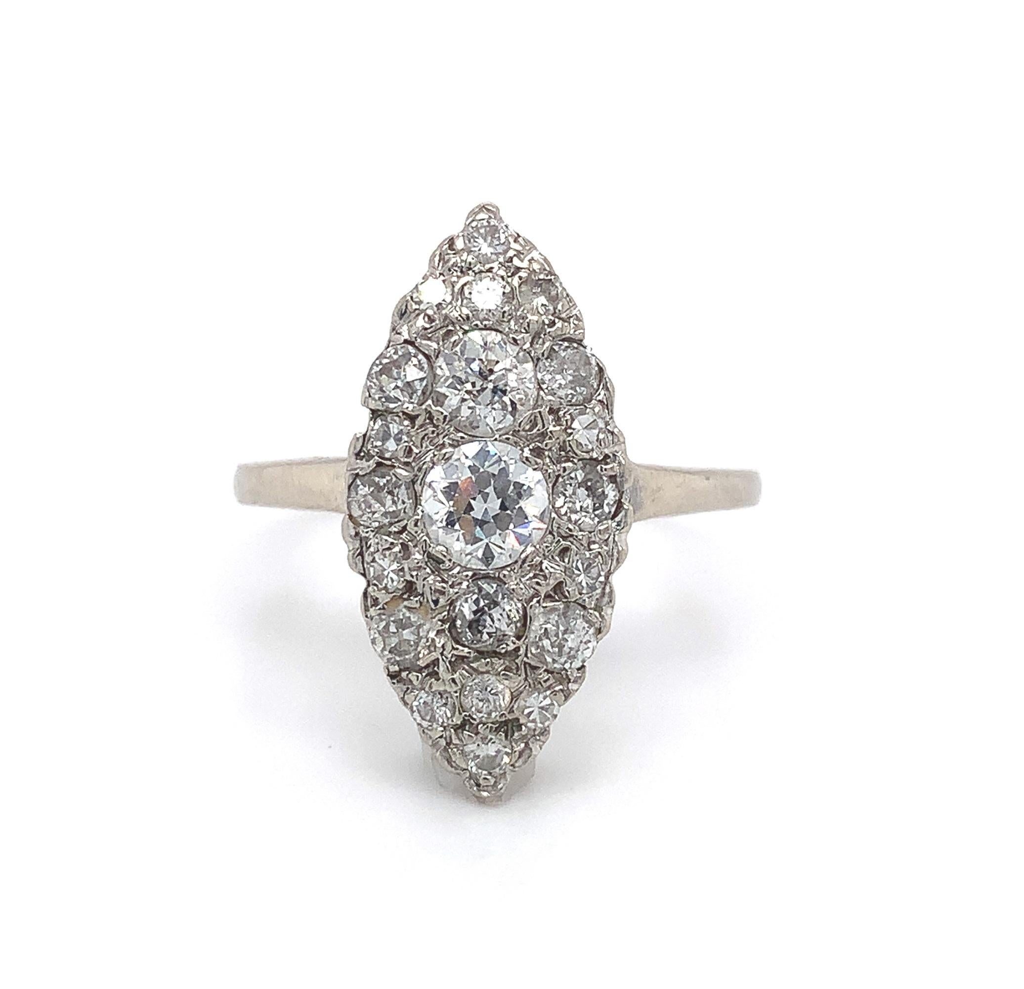 
14k white gold 1 carat tw diamond ring with vintage and antique diamonds set in a marquise shape. The center European cut diamond measures about 4.5mm.  There are 20 surrounding diamonds of various round cuts including mine, European, brilliant and