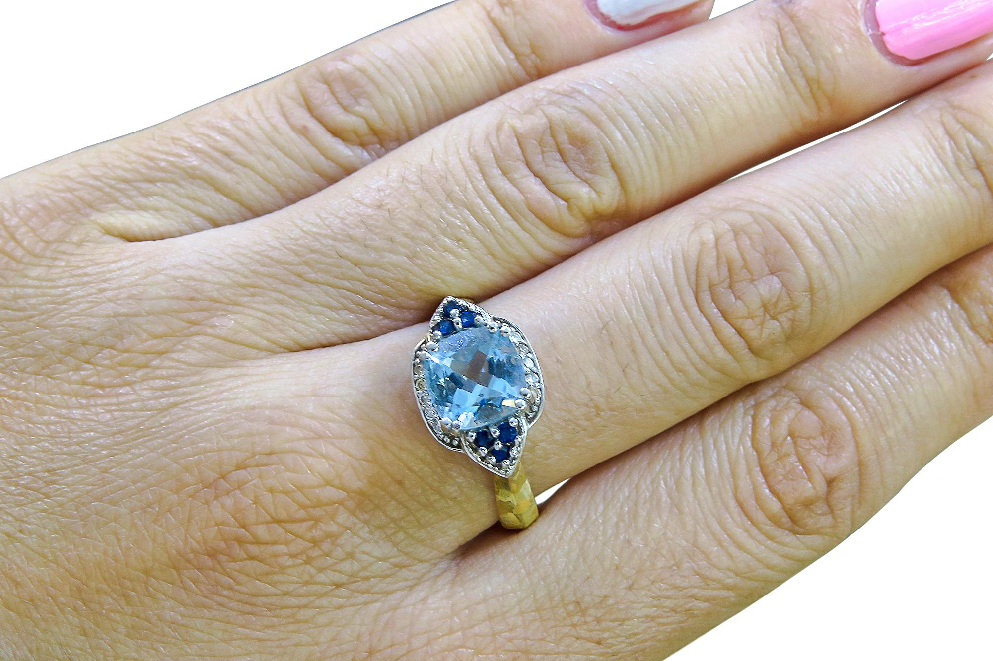 14K Yellow Gold 
Weight= 2.1 gr 
Size= 9 
Diamond= 0.10 Ct total 
Men Stone Blue Topaz= 1.5 Ct total 
Year= 2000 