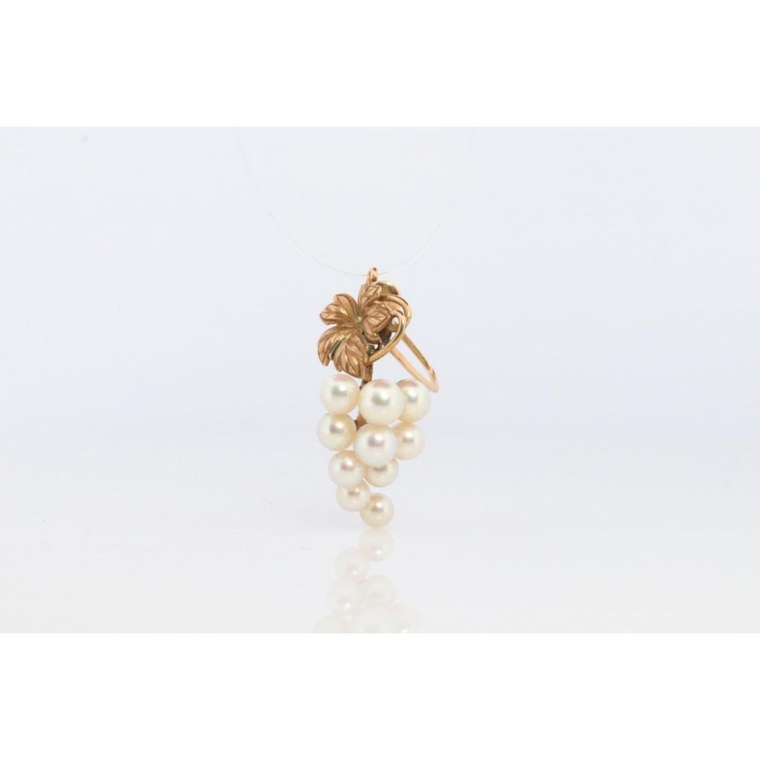 Vintage from the 1960s
Materials: Gold
Gemstone: Pearl

Style: Mid-century


Stunning Designer earrings. World Renowned MIKIMOTO pearls. A cluster of Akoya pearls designed into grape vine.

Pearls have amazing luster. Engraved grape leaf.