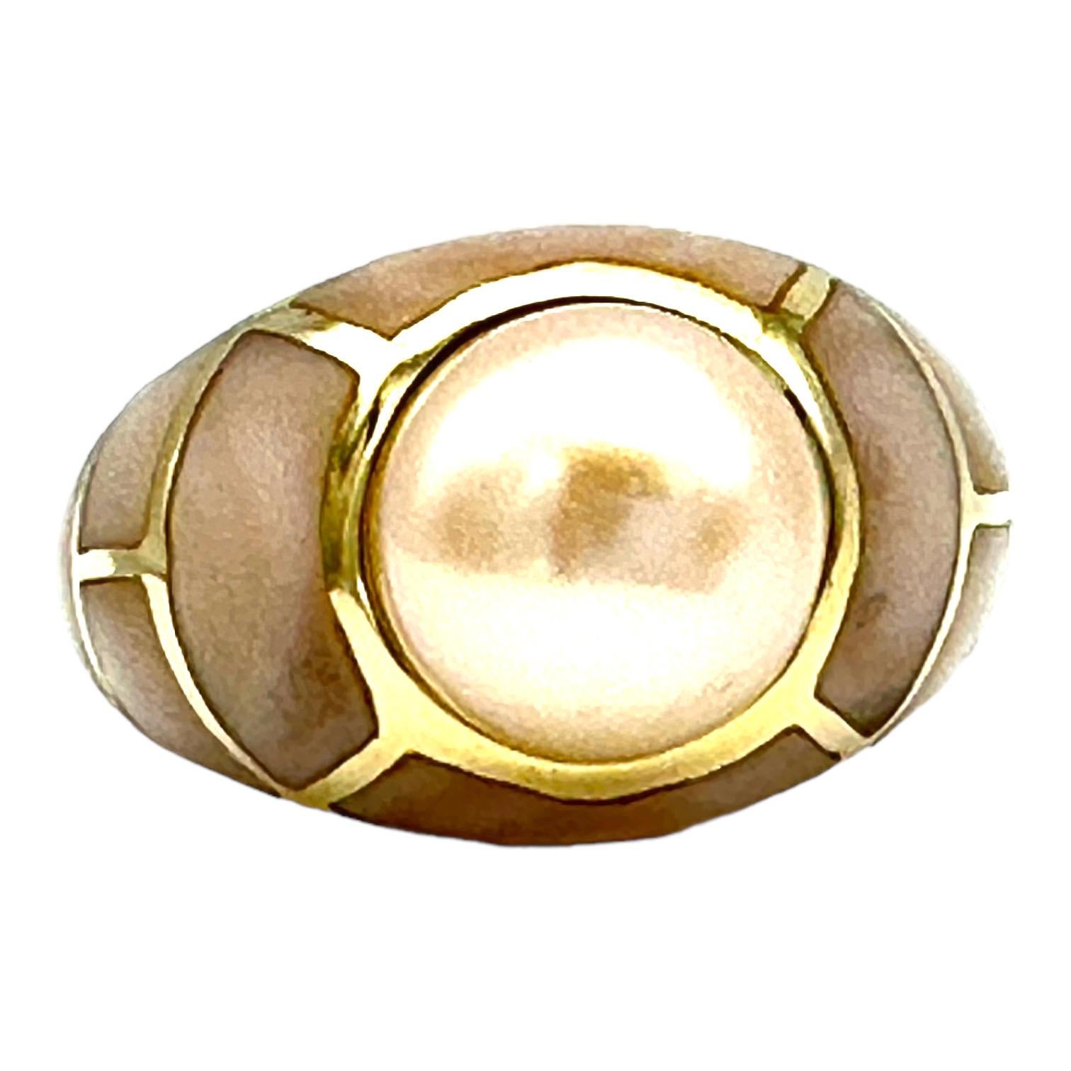 14K dome style ring features a beautiful cultured pearl measuring 9.8 mm; The setting is an inlay-style with a mother of pearl colored in a creamy pink hue. The ring is 12.80 mm wide, and the ring size is 7. 
This ring is both elegant and