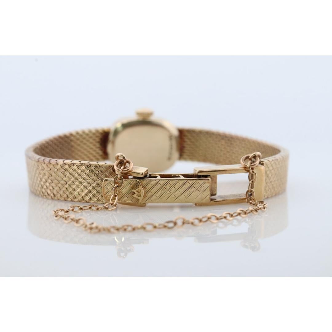 movado 14k gold watch