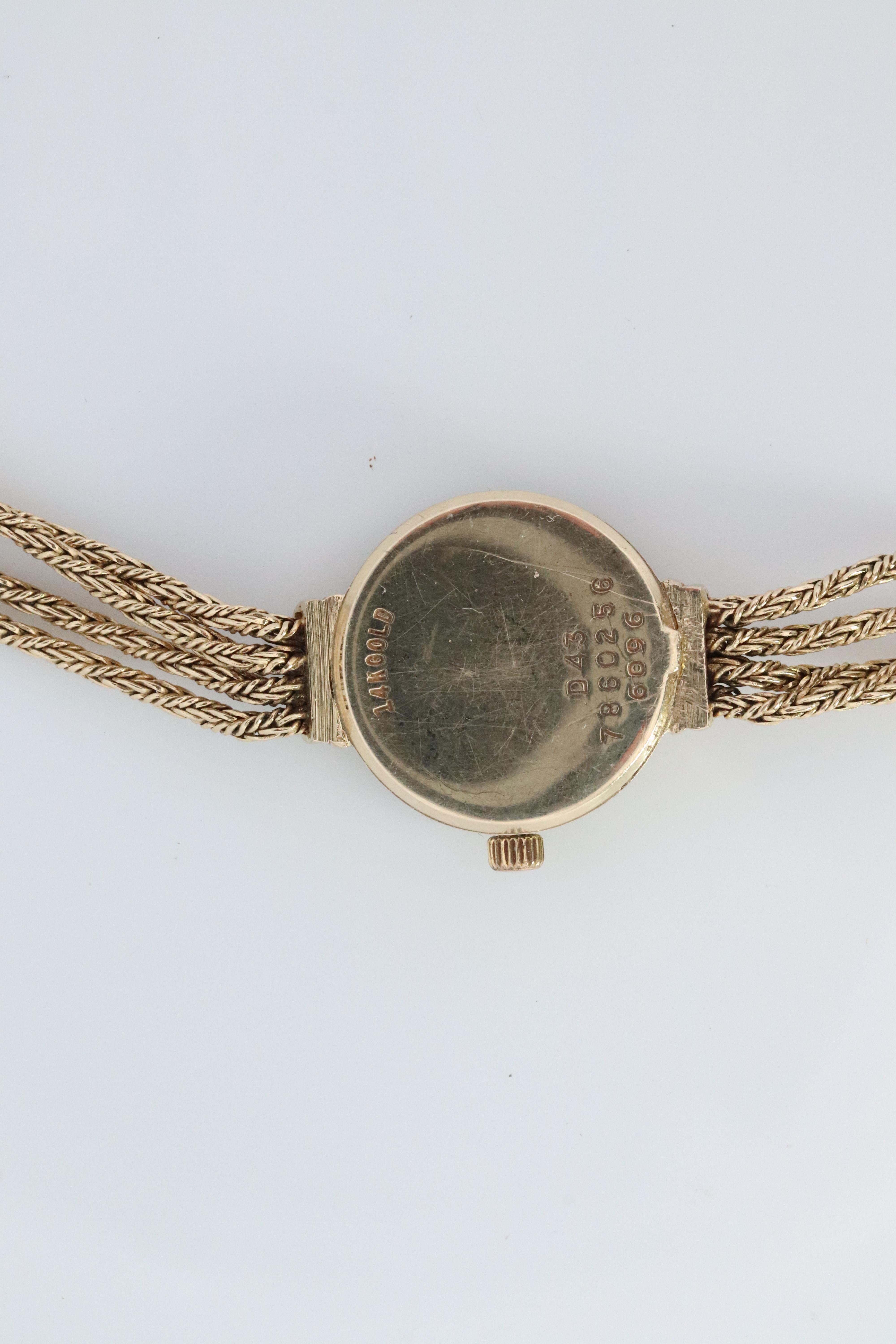 Women's 14k MOVADO Watch. 14k Yellow Gold Ladies Movado Rope Bracelet D43 Wristwatch For Sale