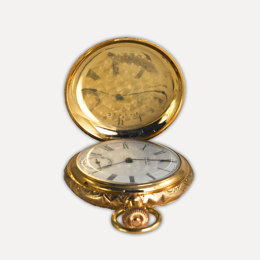 Waltham 14k Multi Color Gold Diamonds Pocket Watch with a 2mm Round Shape Diamond mounted on the Case.
Weighs 61 grams and Measures 1.75 inches.