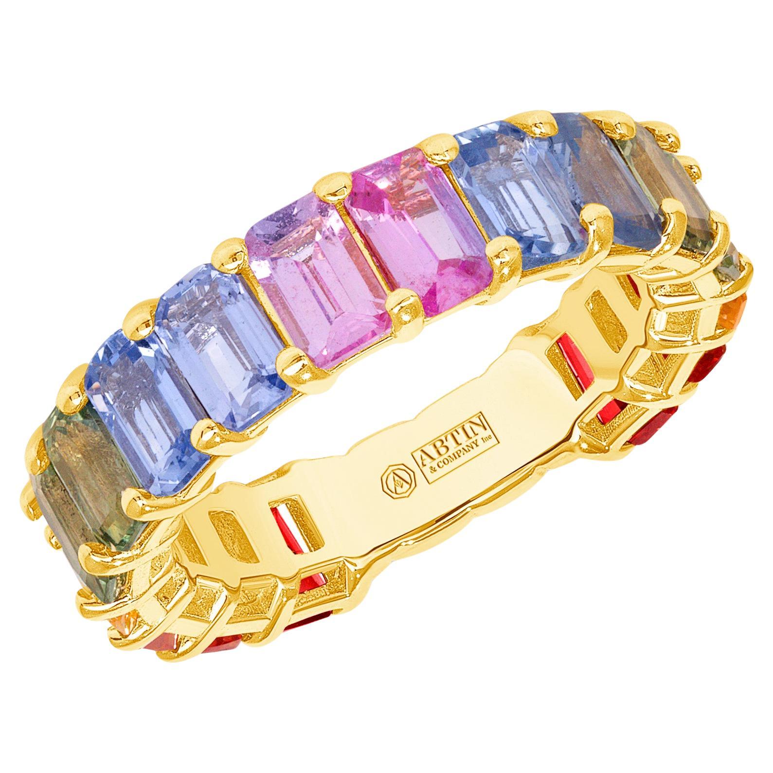 Get all the colors of the rainbow in this 14K gold emerald-cut multicolored sapphire rainbow ring. It's a singular piece that stands out alone and pairs beautifully with other rings glittering in all hues of the rainbow. A unique and classy piece,