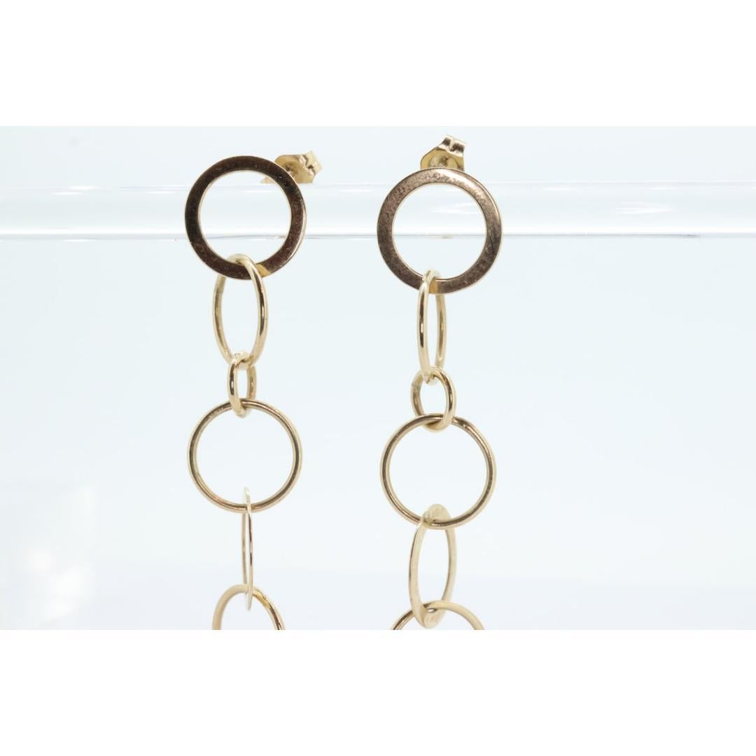 Orecchini pendenti in oro 14k NABCO. Dischi a cerchi intrecciati in oro giallo 14k. In condizioni buone in vendita a Port Charlotte, FL