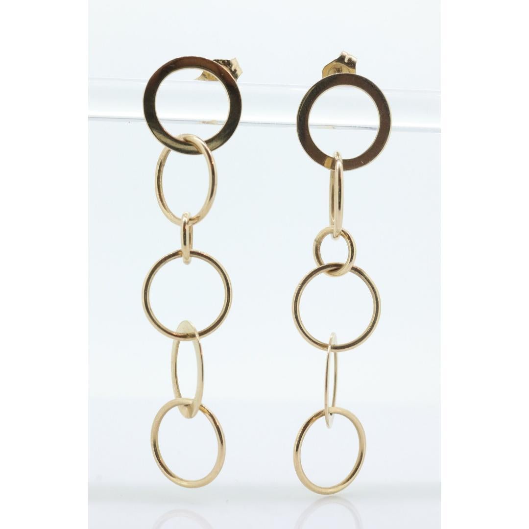 Orecchini pendenti in oro 14k NABCO. Dischi a cerchi intrecciati in oro giallo 14k. in vendita 1
