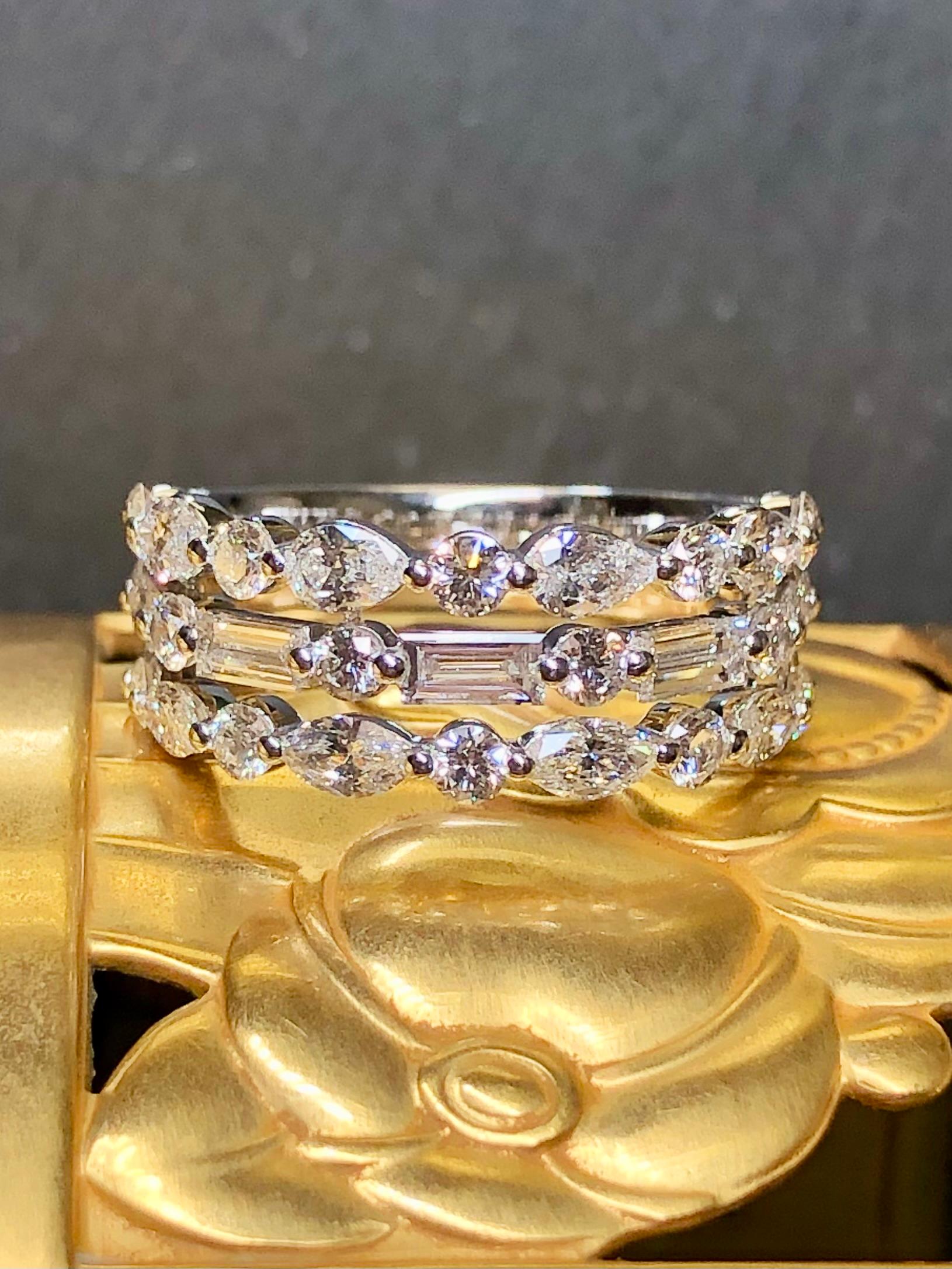 The premiere diamond anniversary band by NEIL LANE done in 14K white gold and set with approximately 2cttw in G-I color Vs1-2 clarity round, baguette, marquise and pear shape diamonds.


Dimensions/Weight:

Ring measures 8mm and is a size 7